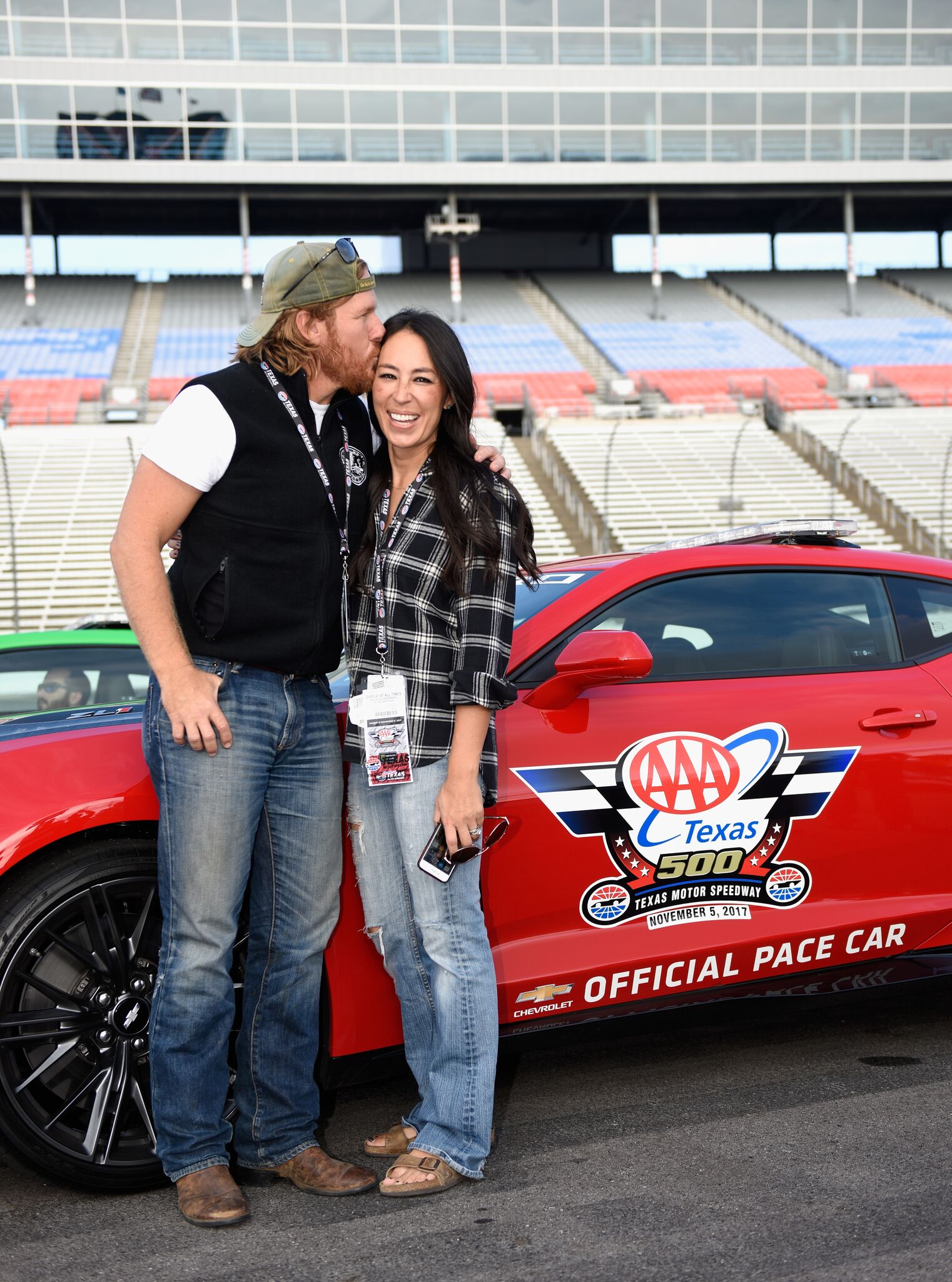 Chip and Joanna Gaines pose with the Monster Energy NASCAR Cup Series AAA Texas 500 pace car | Getty images / Global Images Ukraine