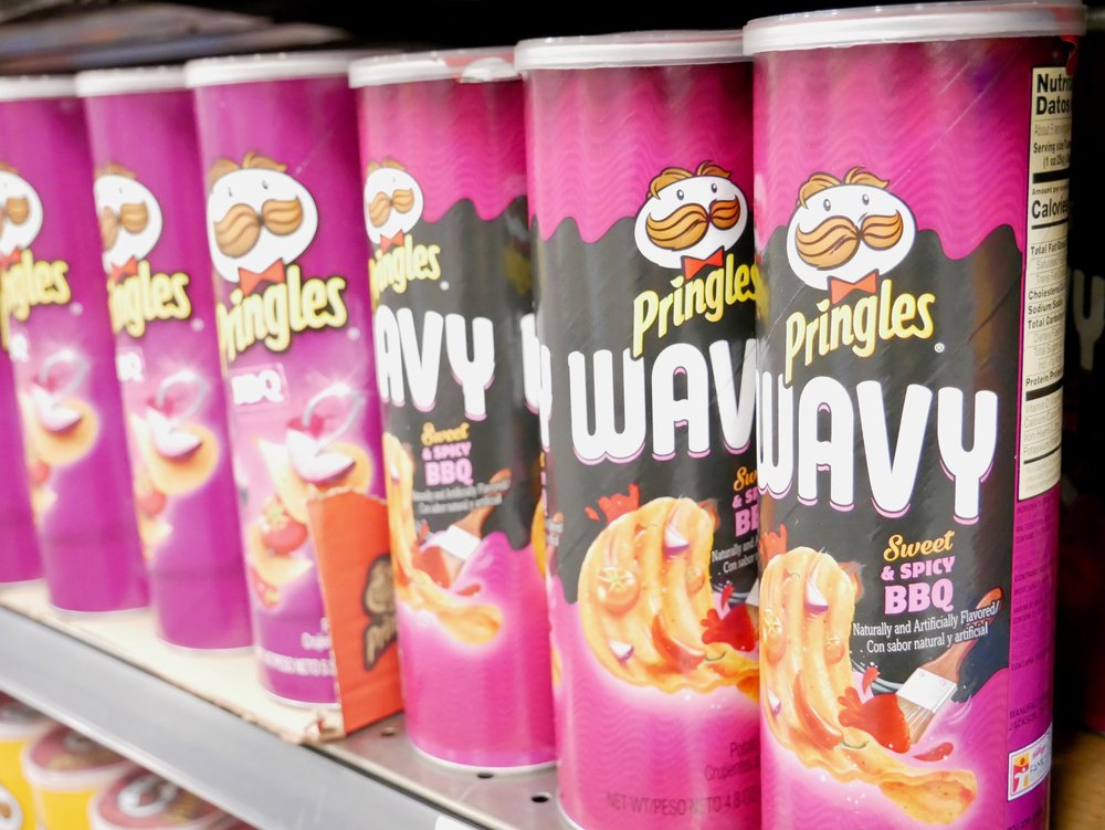 Pringles Wavy Sweet n Spicy BBQ Potato Chips on shelves at local Winco Food Store on November 21, 2020 | Photo: Shutterstock
