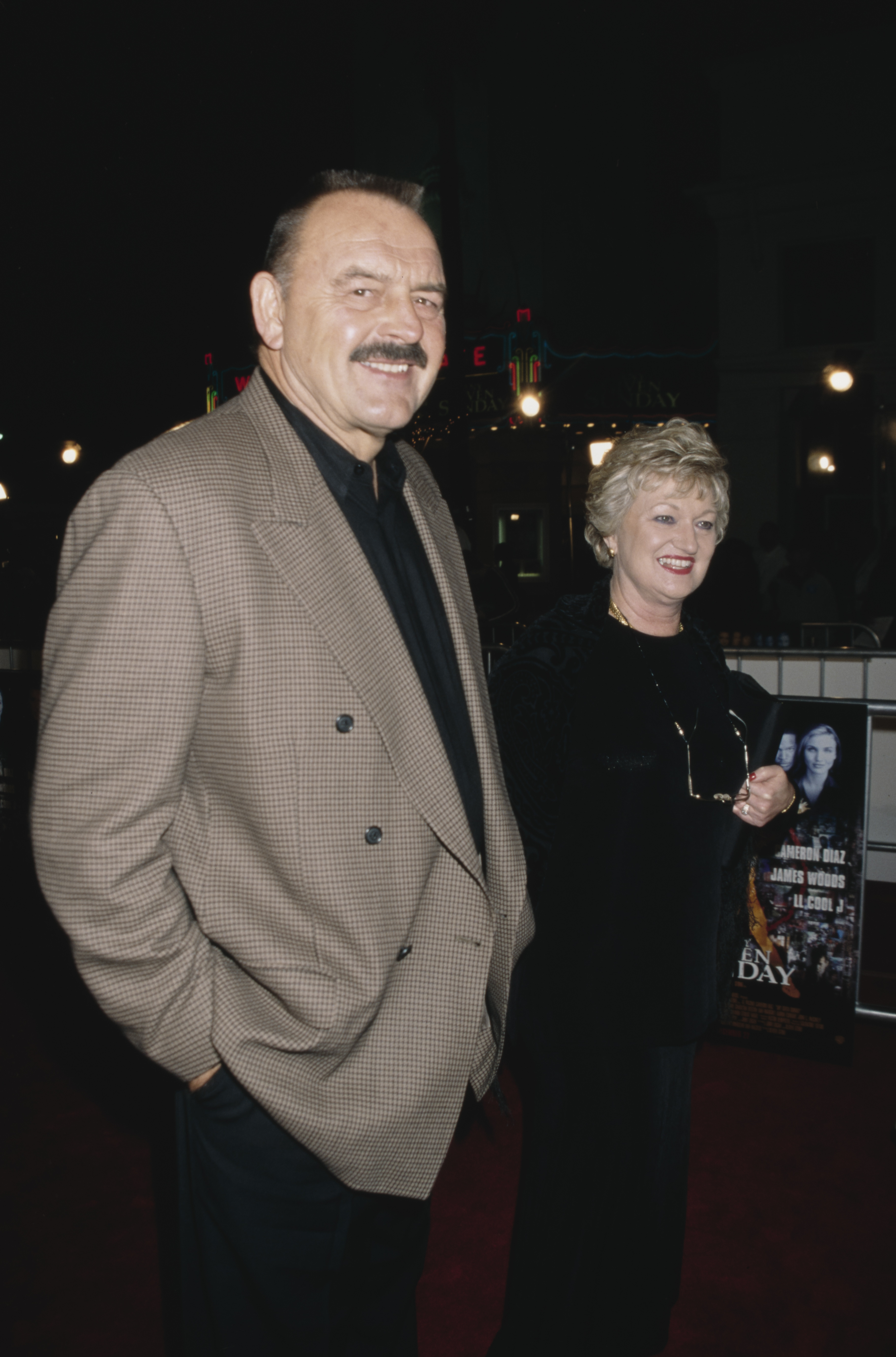 Dick Butkus and Helen Essenhart at the Westwood premiere of "Any Given Sunday," 1999 | Sources: Getty Images