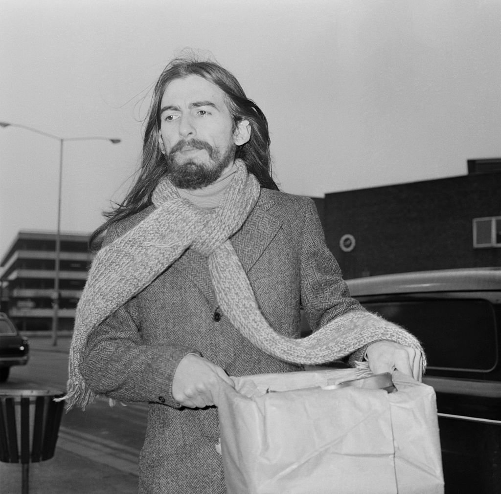 English guitarist, singer and songwriter George Harrison (1943 - 2001) of the Beatles at London Airport | Getty Images / Global Images Ukraine English guitarist, singer and songwriter George Harrison (1943 - 2001) of the Beatles at London Airport | Getty Images / Global Images Ukraine