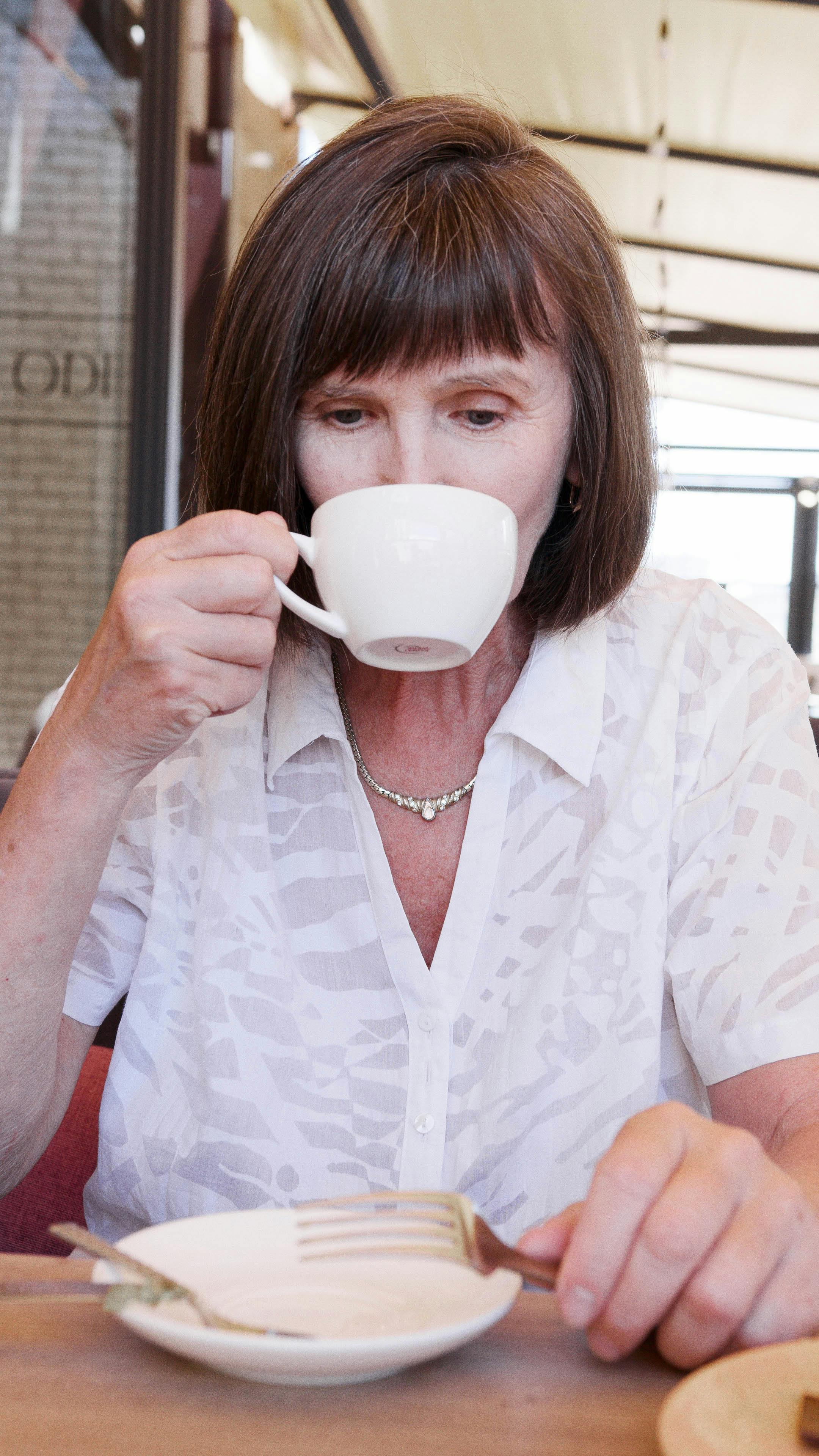 A woman sipping coffee | Source: Pexels