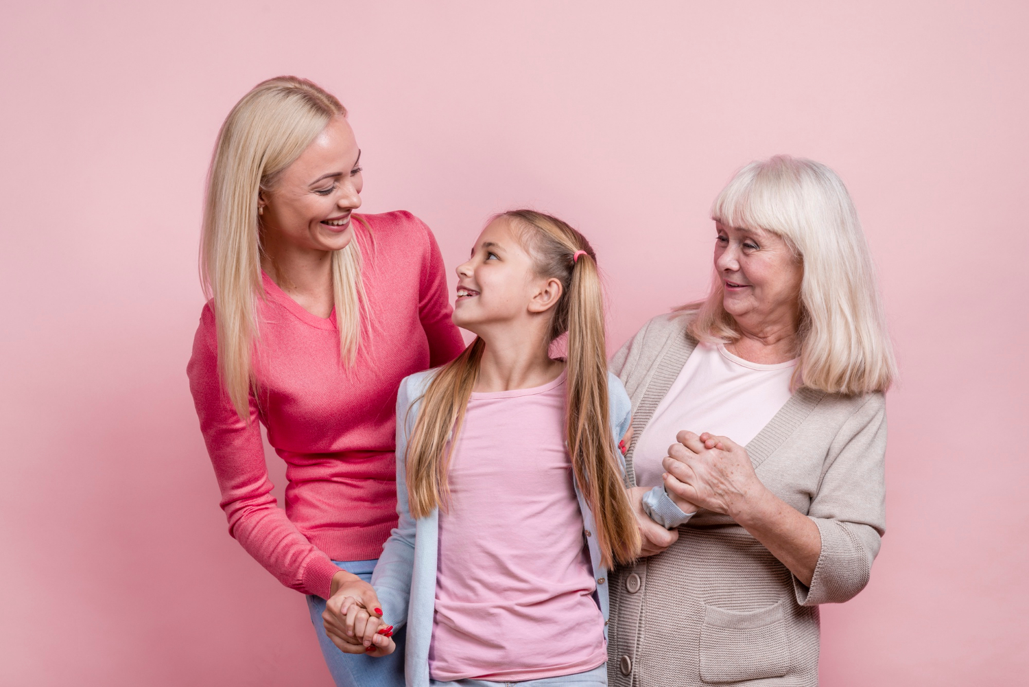 A young girl with her mother and grandmother | Source: Freepik