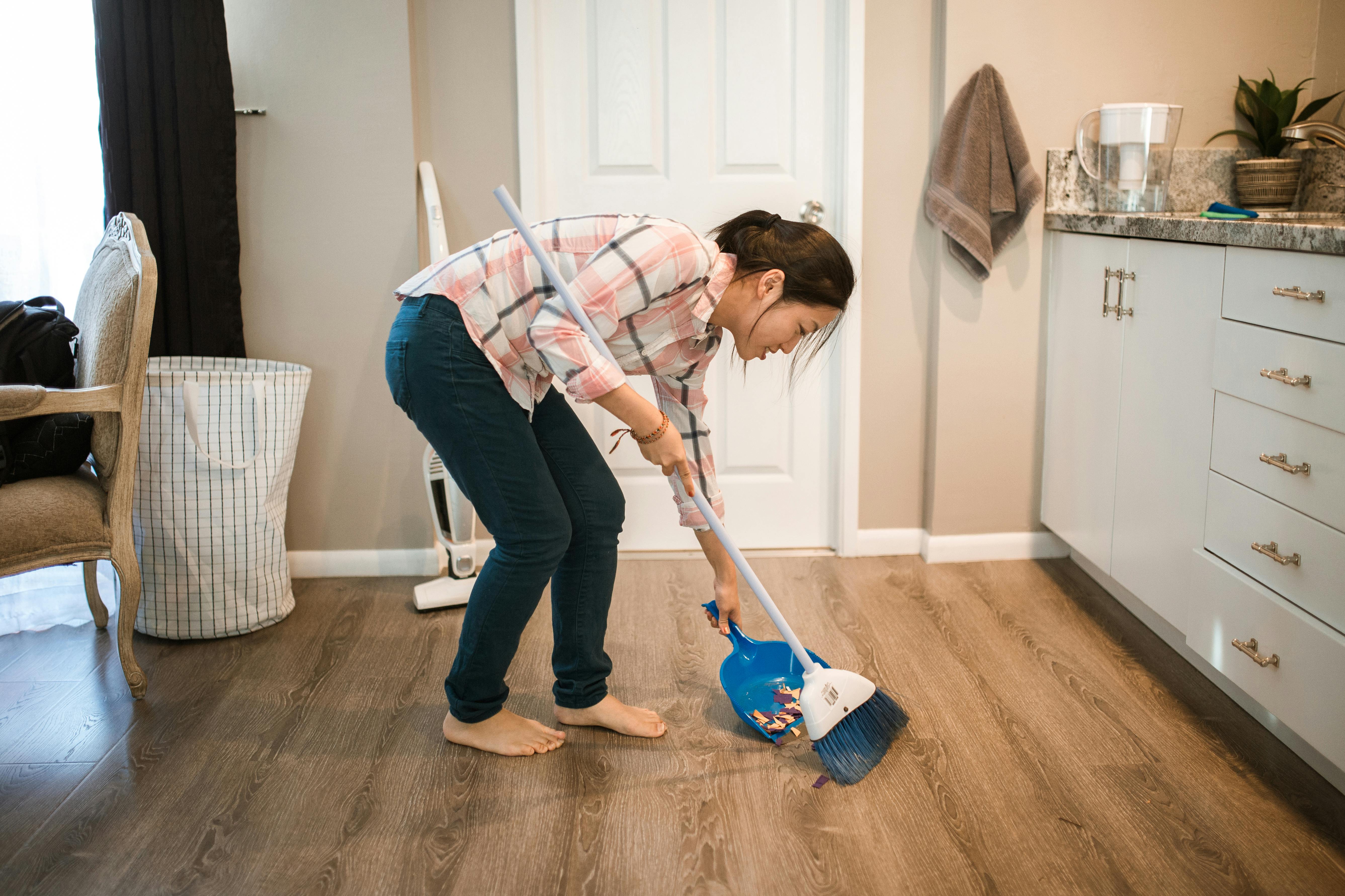 A woman mopping her floor | Source: Pexels