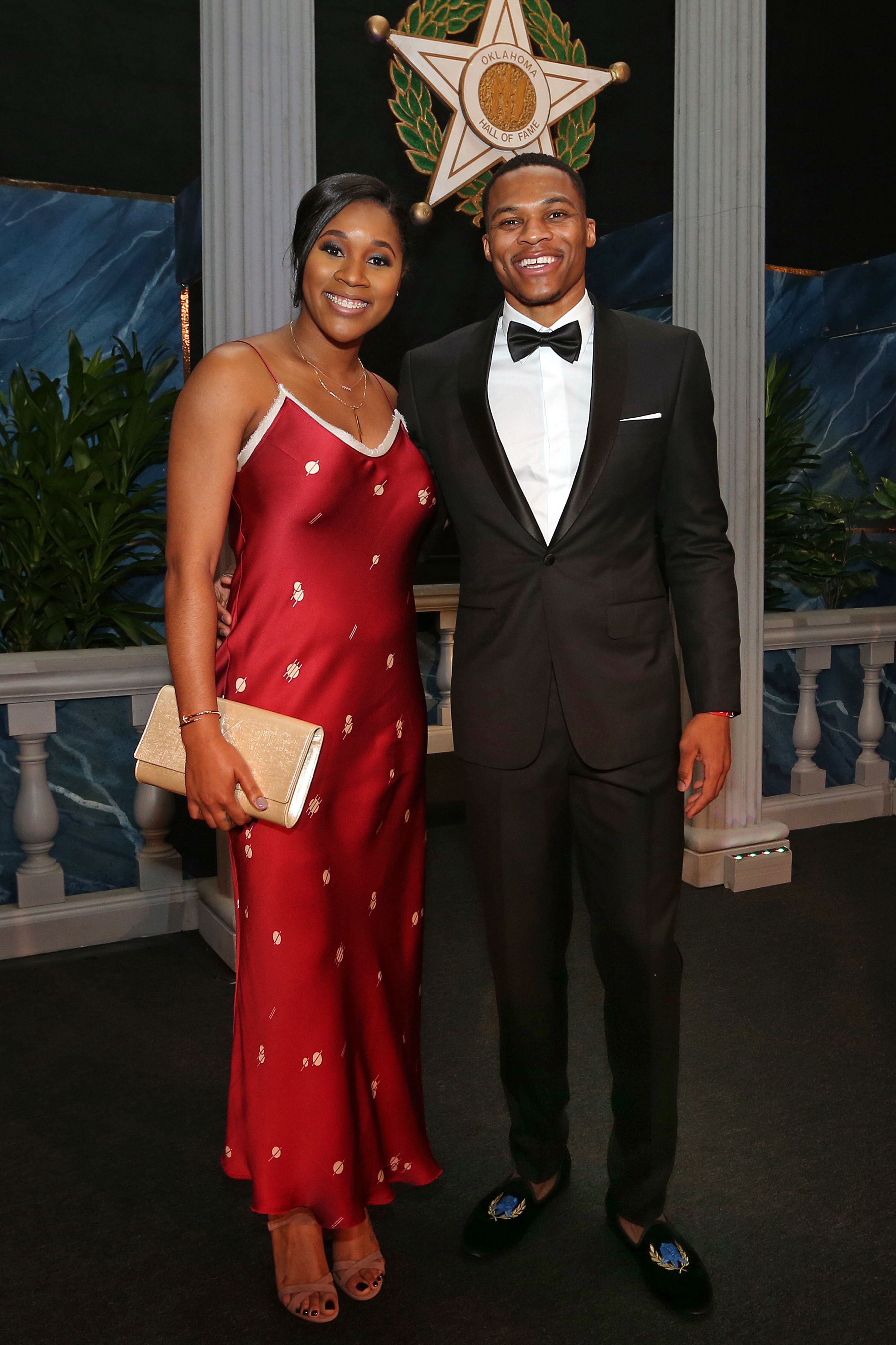 Russell Westbrook #0 of the Oklahoma City Thunder poses for a photo with his wife, Nina Ann-Marie Westbrook, before he is inducted into the Oklahoma Hall of Fame on November 17, 2016 at the Cox Convention Center in Oklahoma City, Oklahoma. | Source: Getty Images