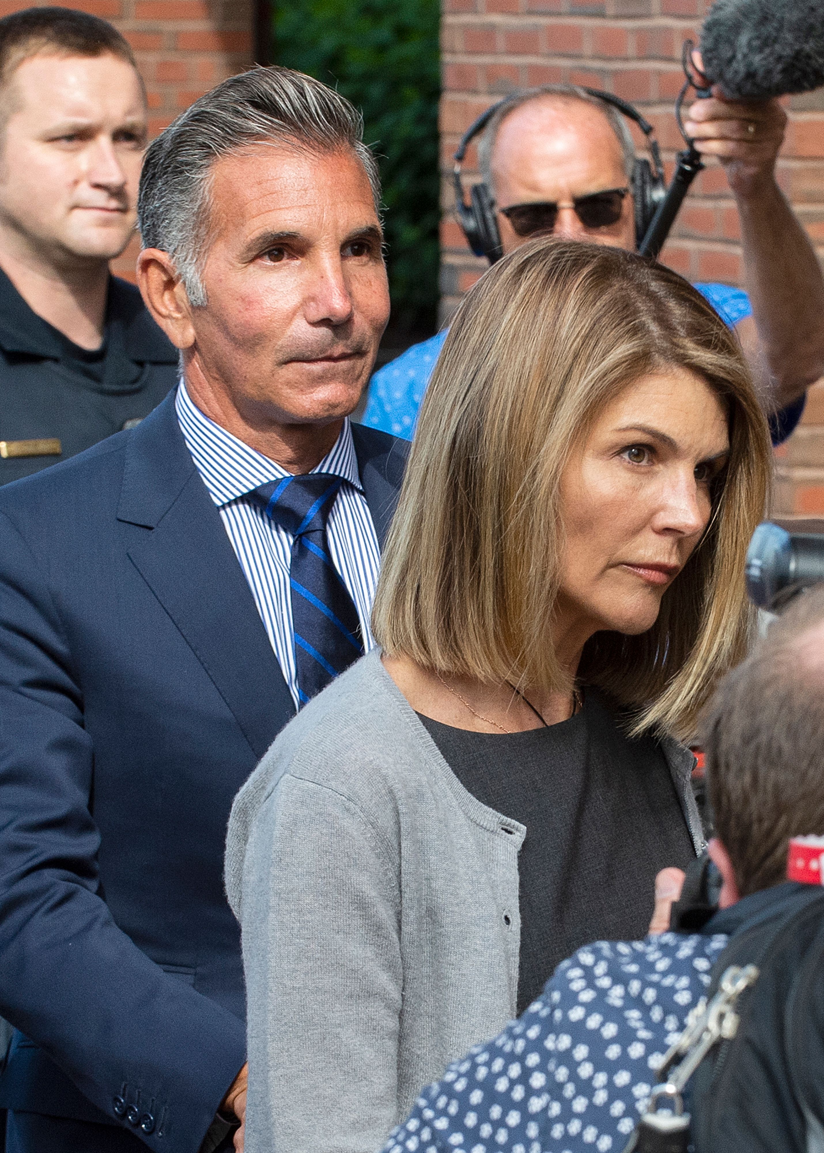Mossimo Giannulli and Lori Loughlin exiting Boston Federal Court house after a pre-trial hearing in Massachusetts on August 27, 2019. | Source: Getty Images
