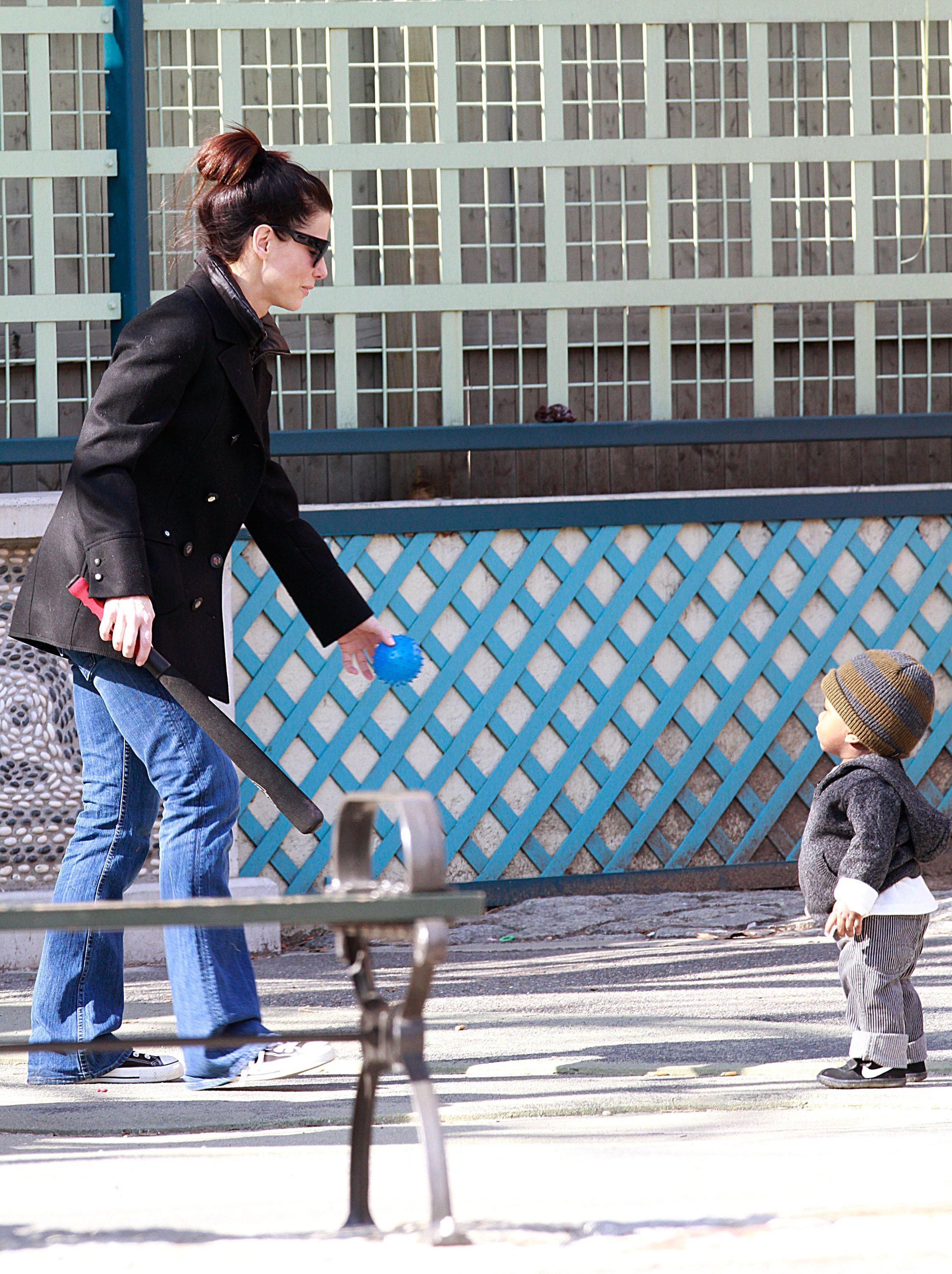 Sandra Bullock and her son Louis spotted playing in New York City on March 20, 2011 | Source: Getty Images 