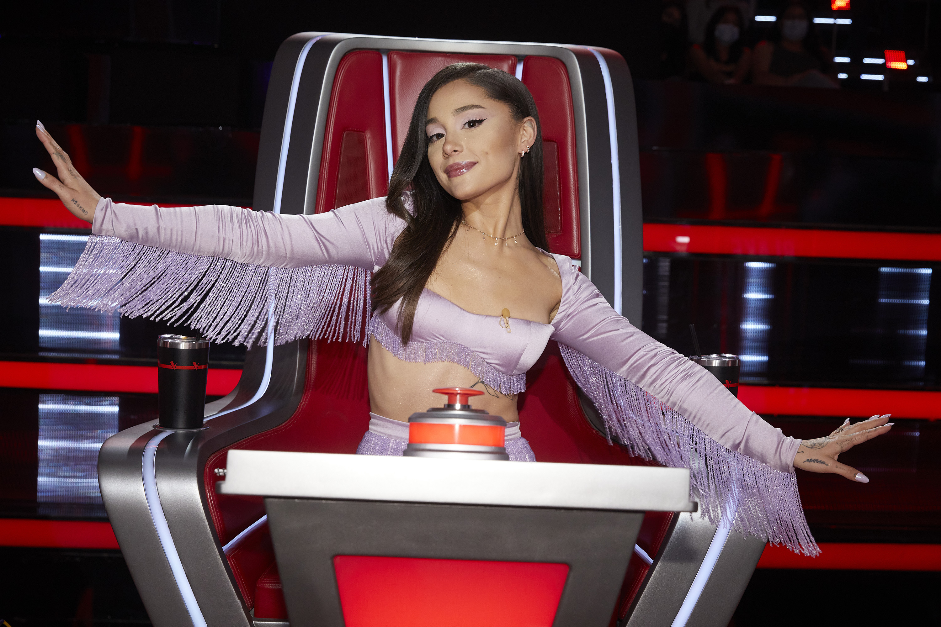 Ariana Grande poses during a taping of "The Voice"| Source: Getty Images