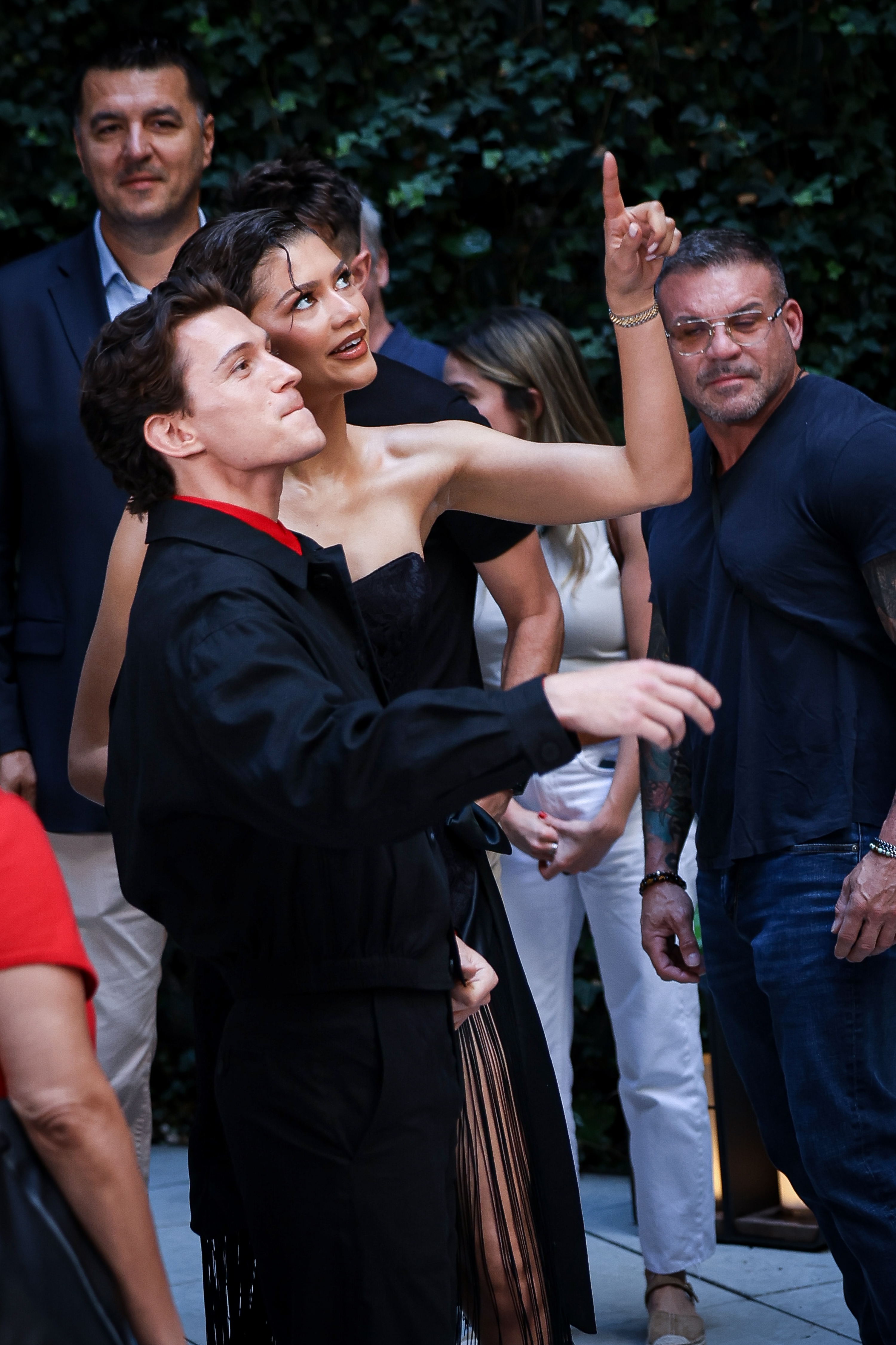 They still appeared close, although they seemed somewhat distracted by something above them. | Source: Getty Images