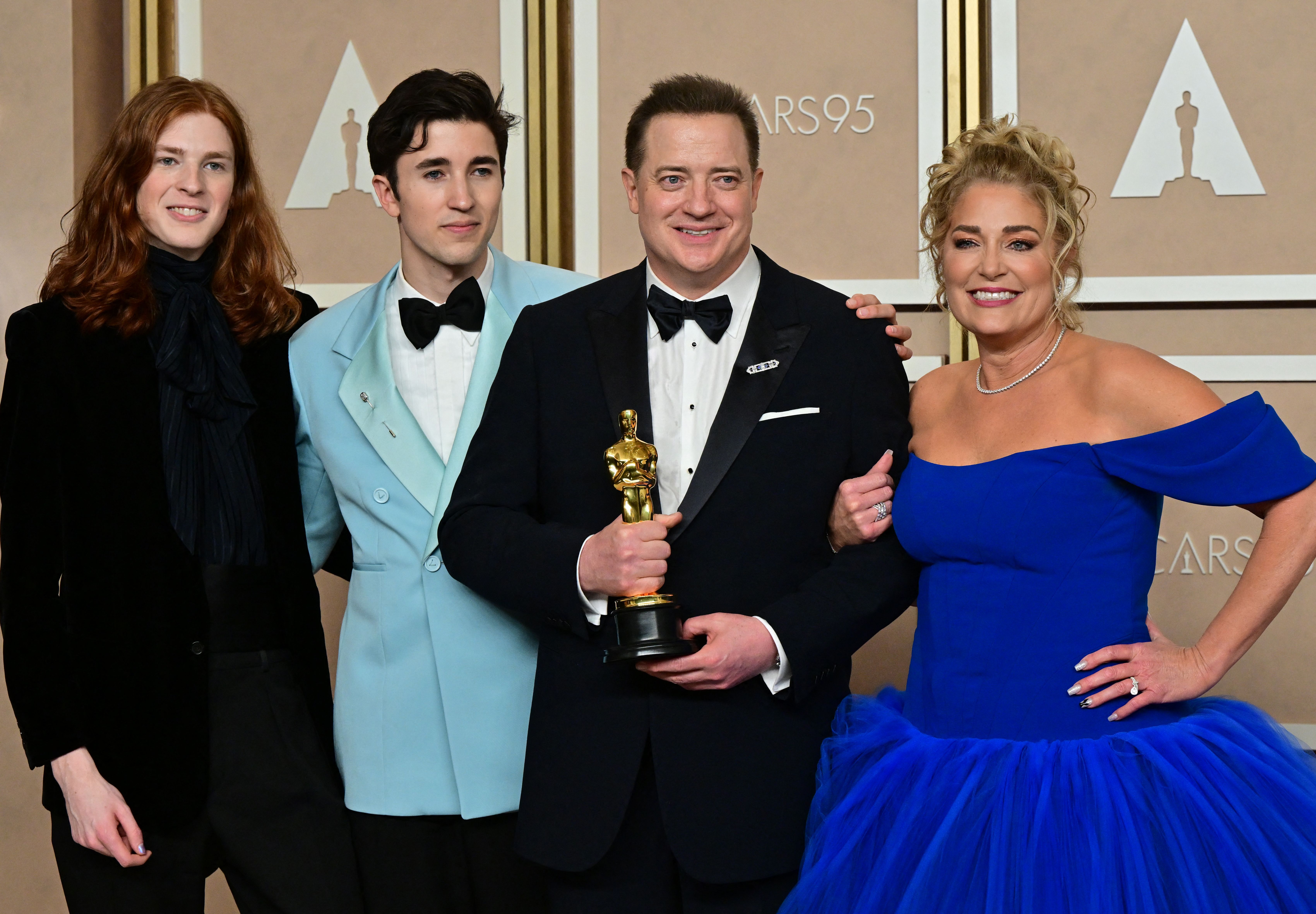 Leland and Holden Fraser with their father Brendan Fraser and his partner Jeanne Moore at the 2023 Oscars. | Source: Getty Images