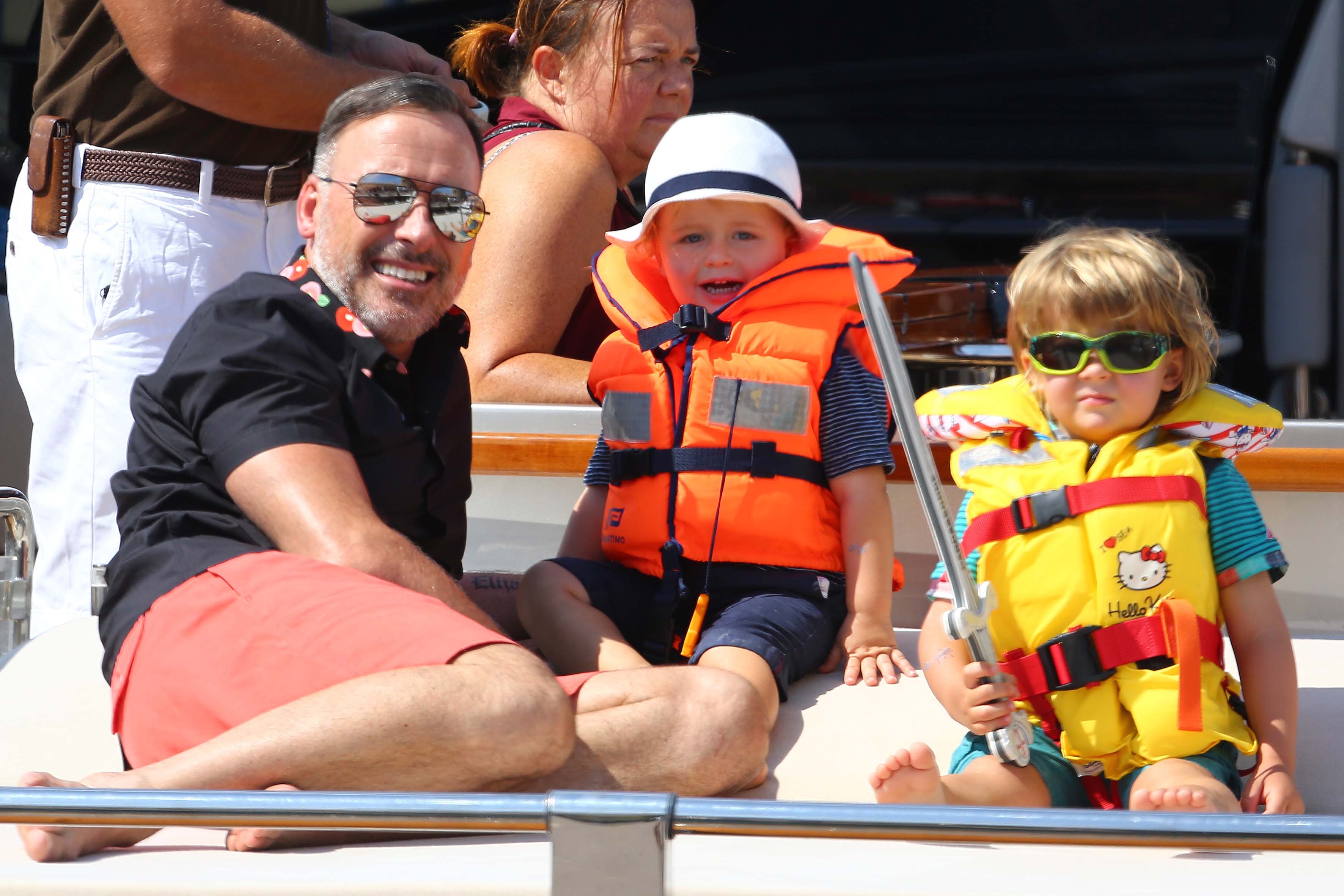 David Furnish with sons Zachary and Elijah during a family outing in Saint-Tropez, France, on August 19, 2014 | Source: Getty Images