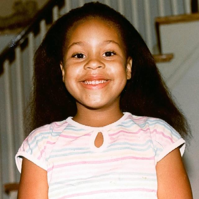 A young Sheinelle Jones gives the camera a wide grin, from a post dated March 25, 2021. | Source: Facebook/SheinelleJones