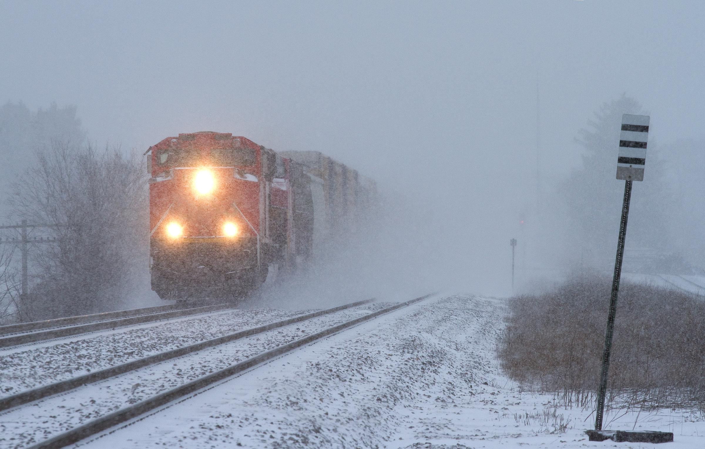 A southbound freight train blasting through a snowstorm in Wisconsin, dated July 28, 2012 | Source: Getty Images