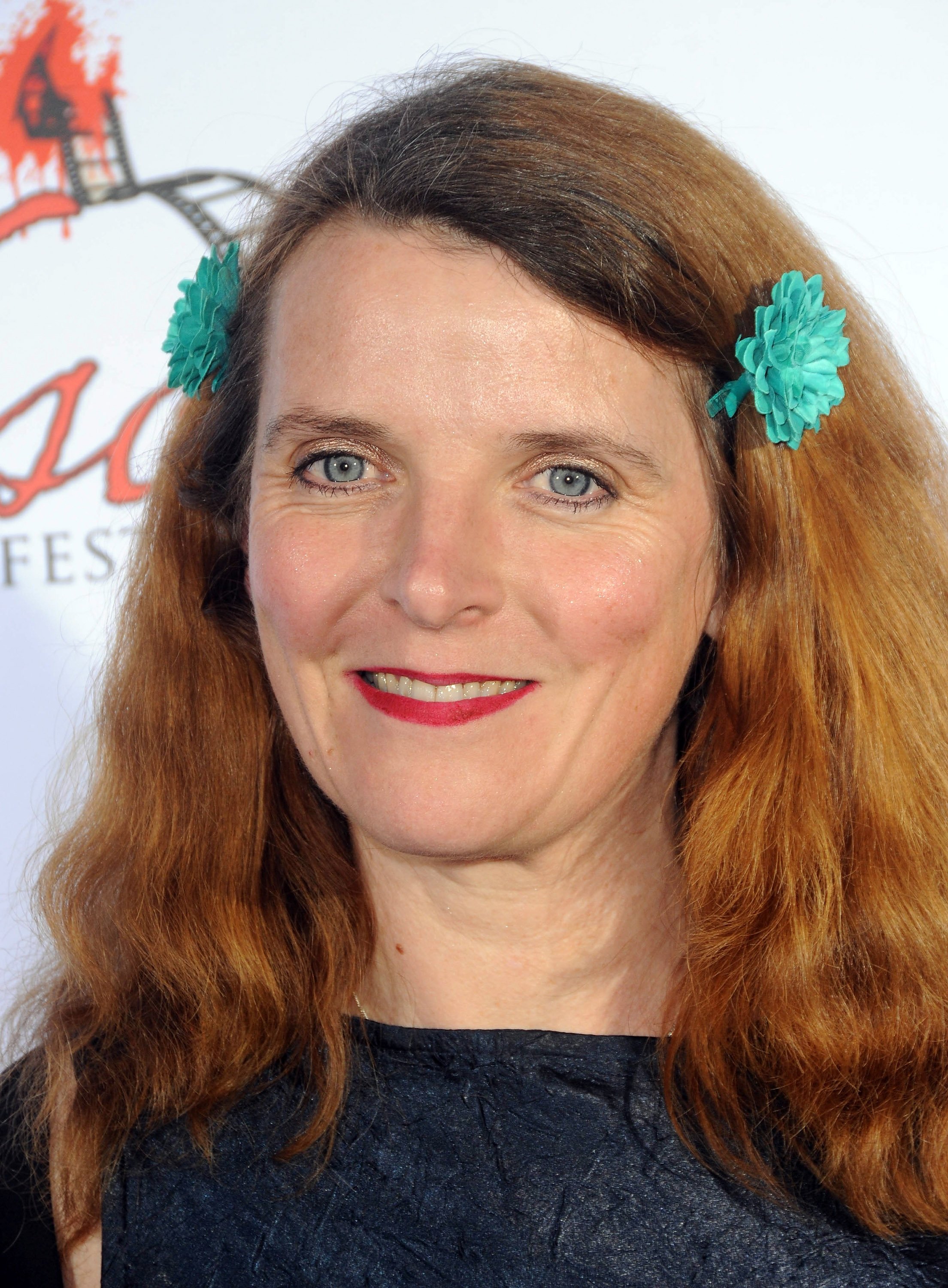 Actress Abigail Hopkins arriving for the screening of "Among Friends" at the Jon Lovitz Comedy Club on April 17, 2012 in Universal City, California.┃Source: Getty Images