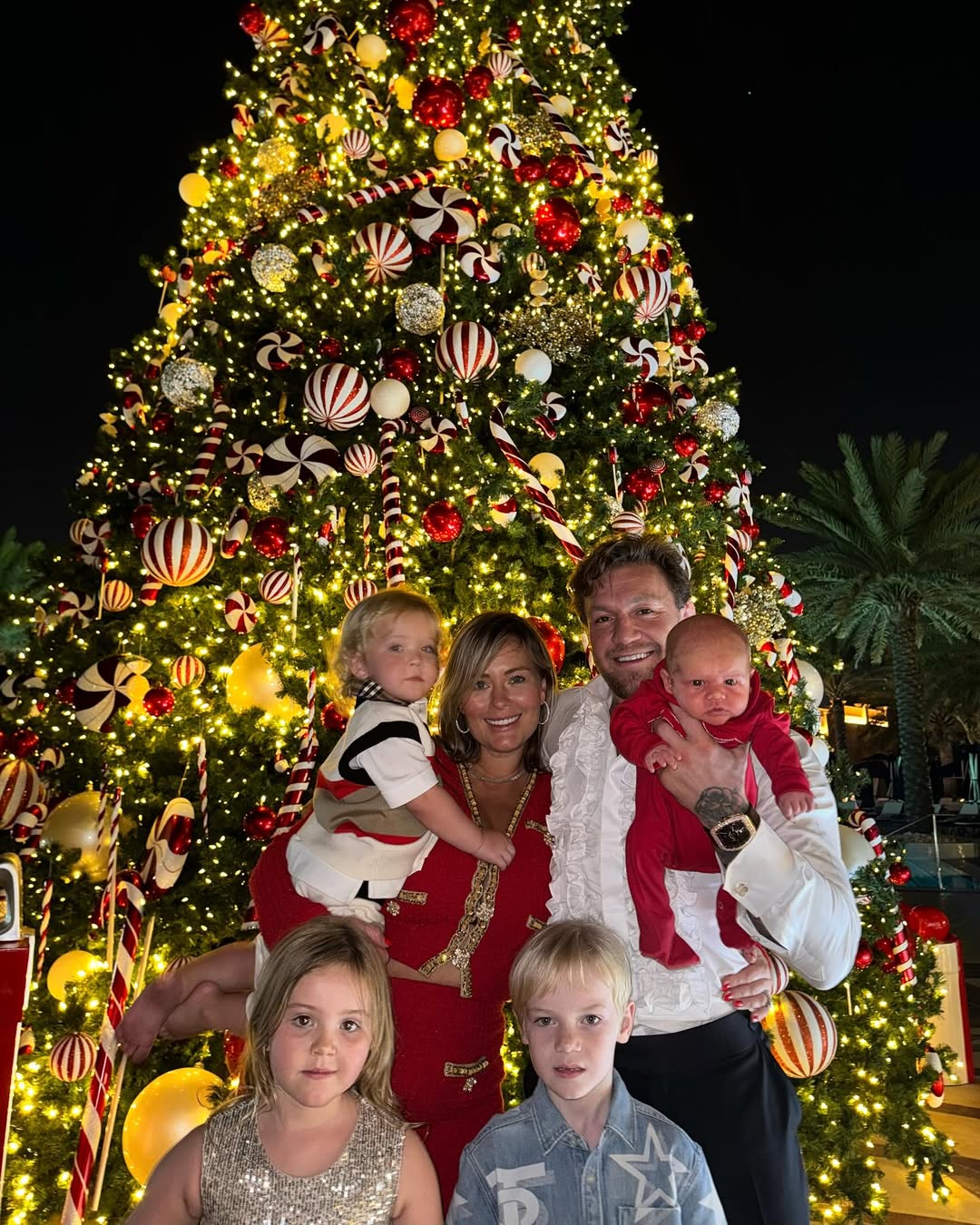 Conor McGregor and Dee Devlin with their children from a post dated December 25, 2023. | Source: Instagram/thenotoriousmma