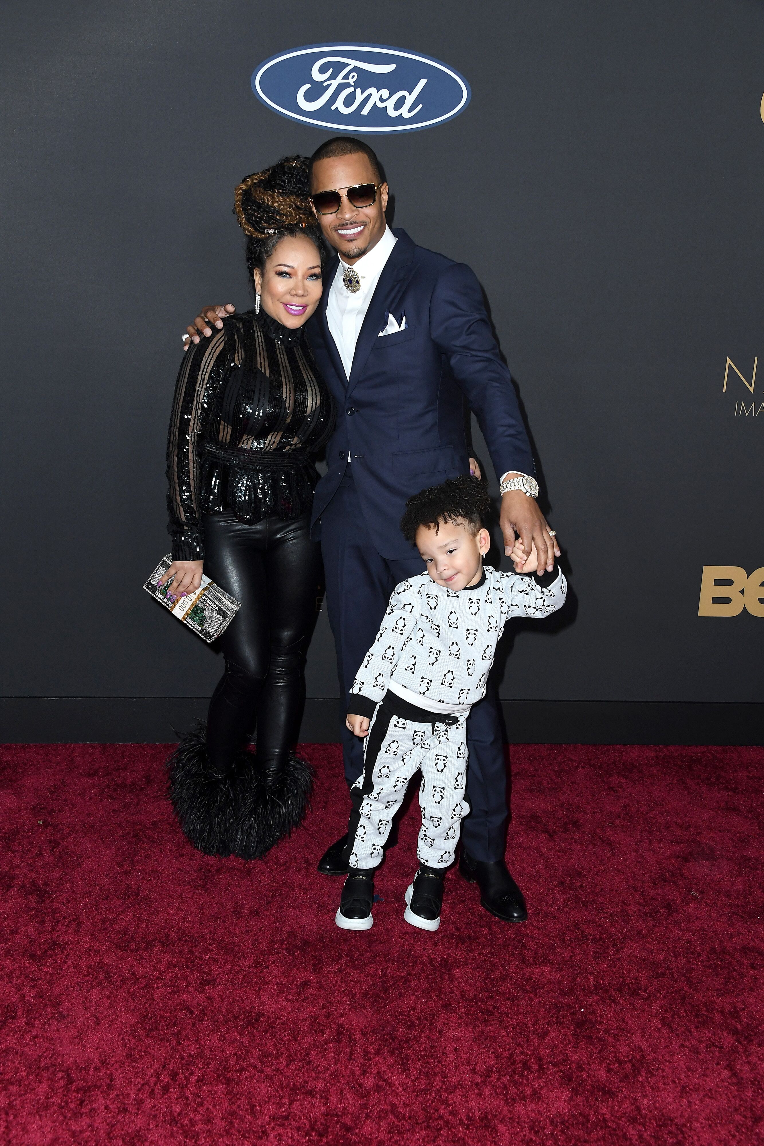 T.I. and Tiny Harris with their daughter Heiress at the 51st NAACP Awards Red Carpet at Pasadena | Source: Getty Images/GlobalImagesUkraine