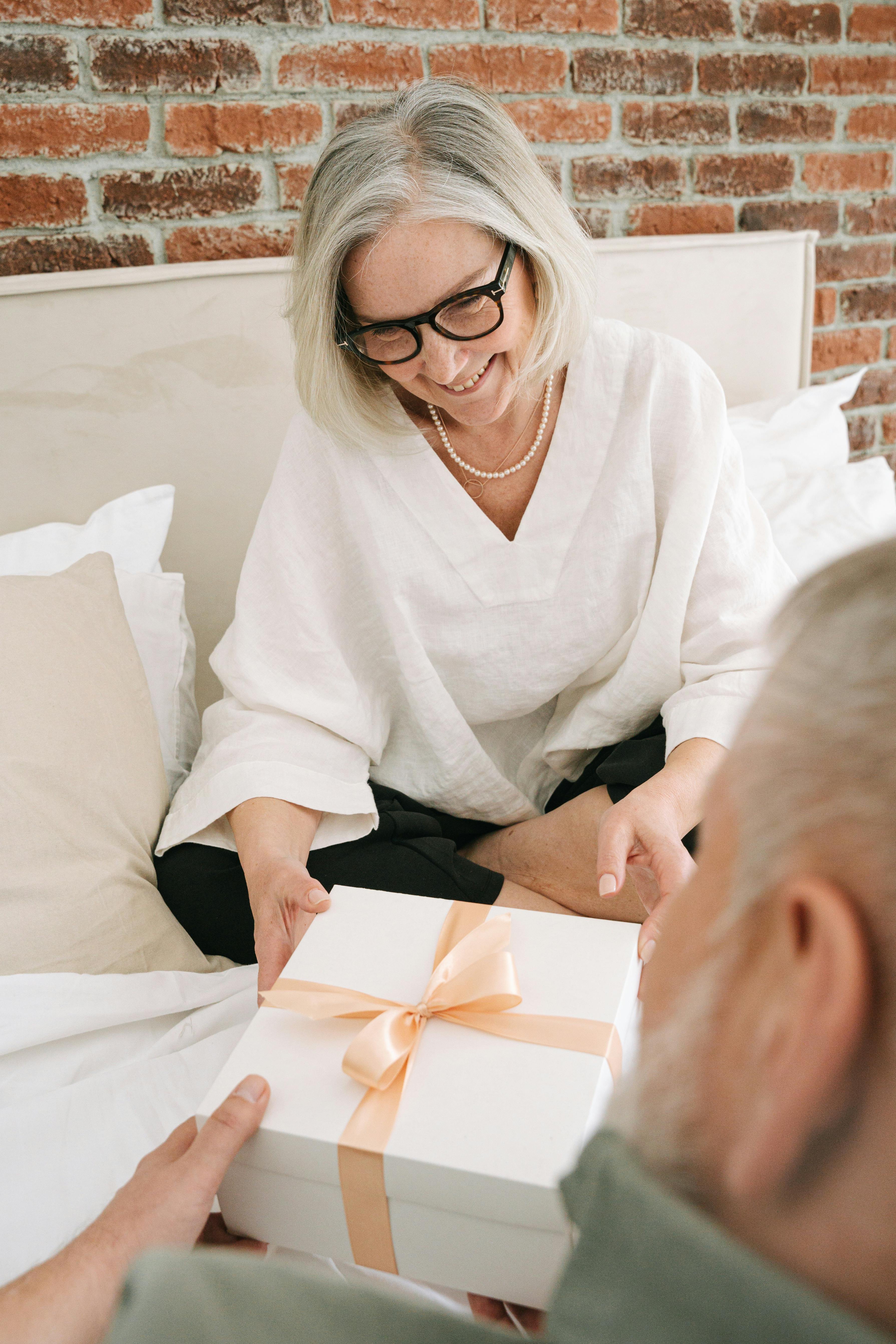 A happy woman receiving a gift | Source: Pexels