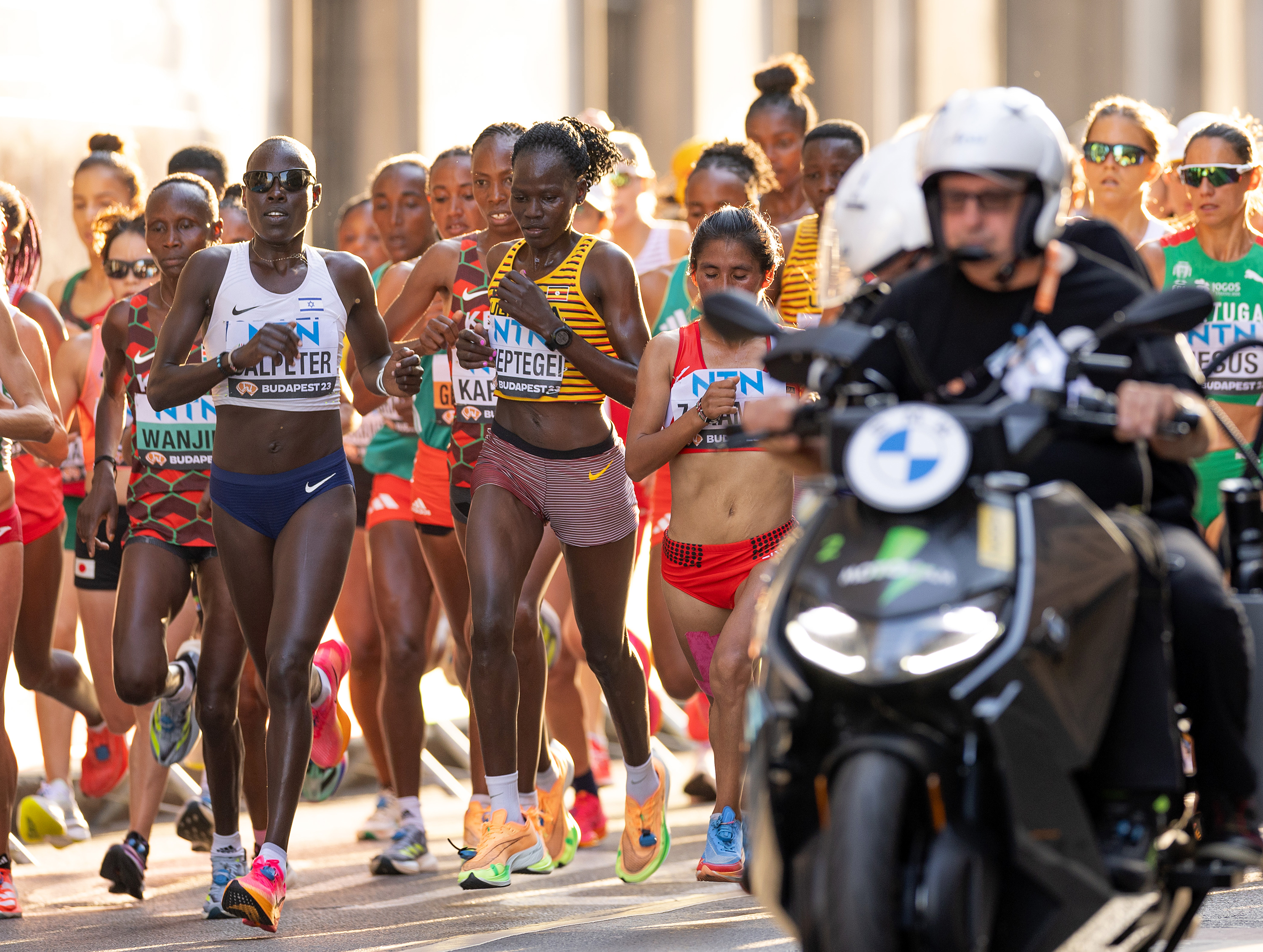 Rebecca Cheptegei competes alongside other runners in the women's marathon final during day 8 of the World Athletics Championships in Budapest on August 26, 2023 | Source: Getty Images