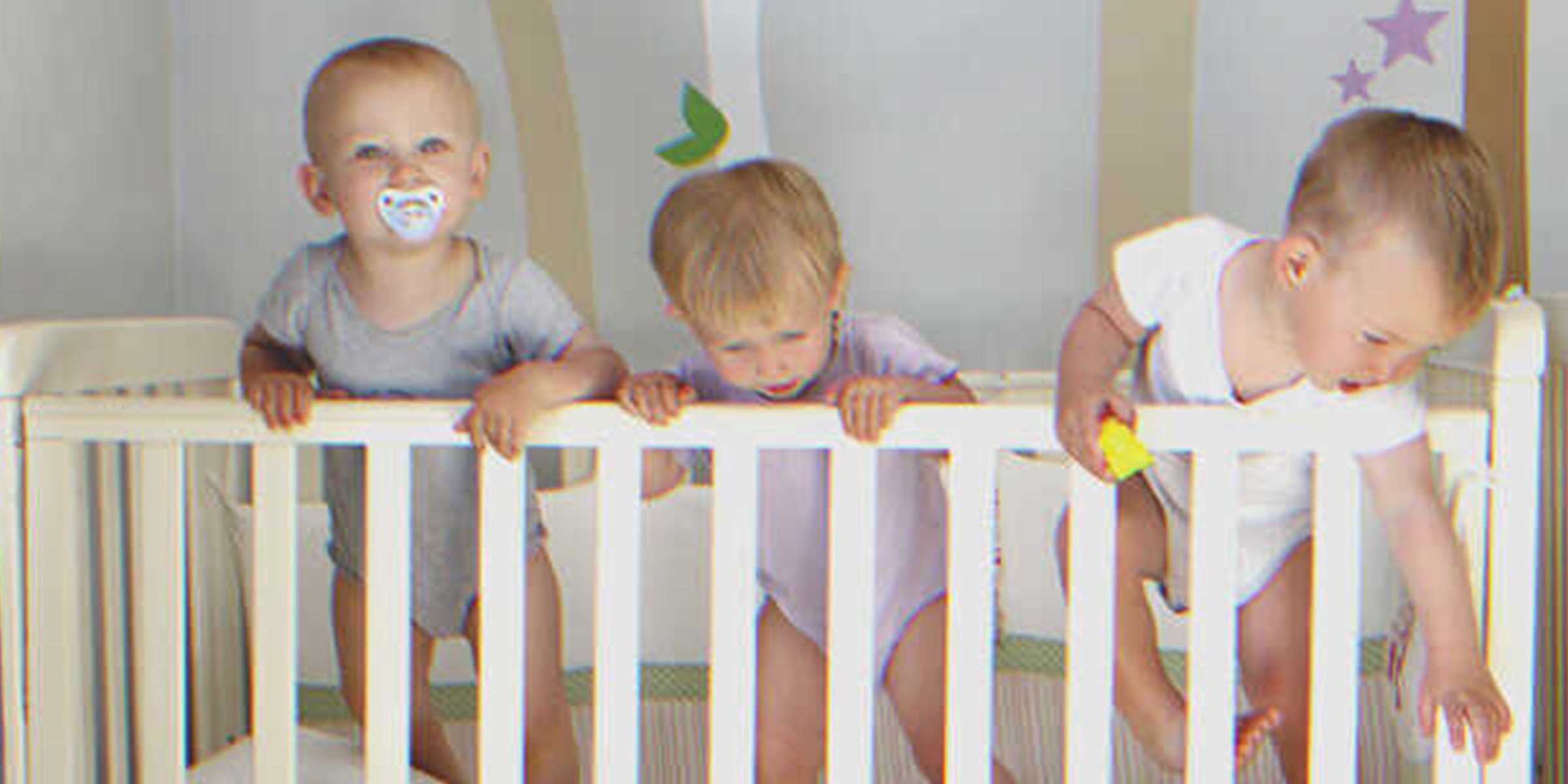 Triplets in a crib | Source: Shutterstock