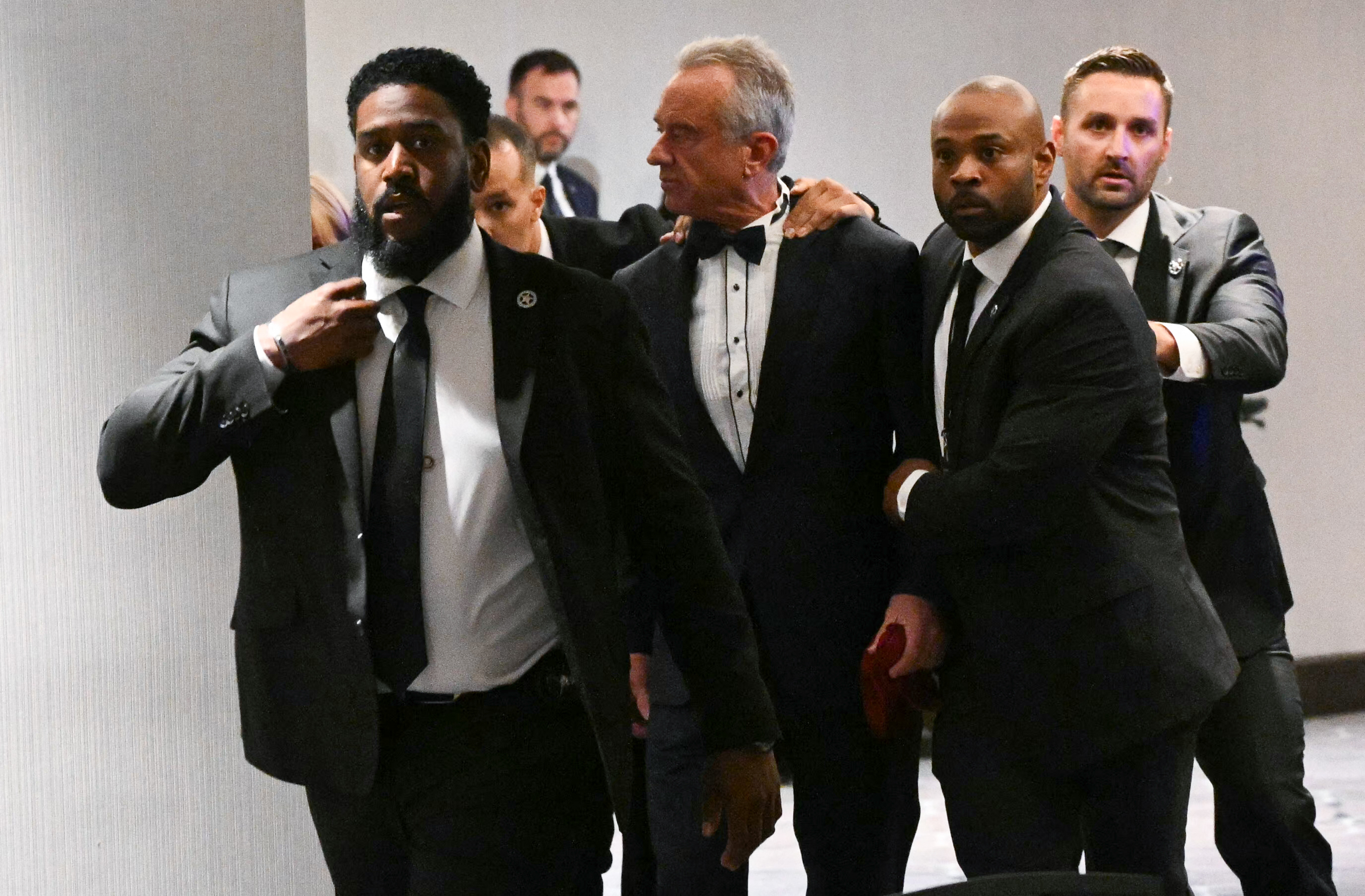 Robert F. Kennedy Jr. is rushed out by Secret Service agents after loud bangs were heard during the White House Correspondents' Dinner at Washington Hilton on April 25, 2026, in Washington, DC | Source: Getty Images