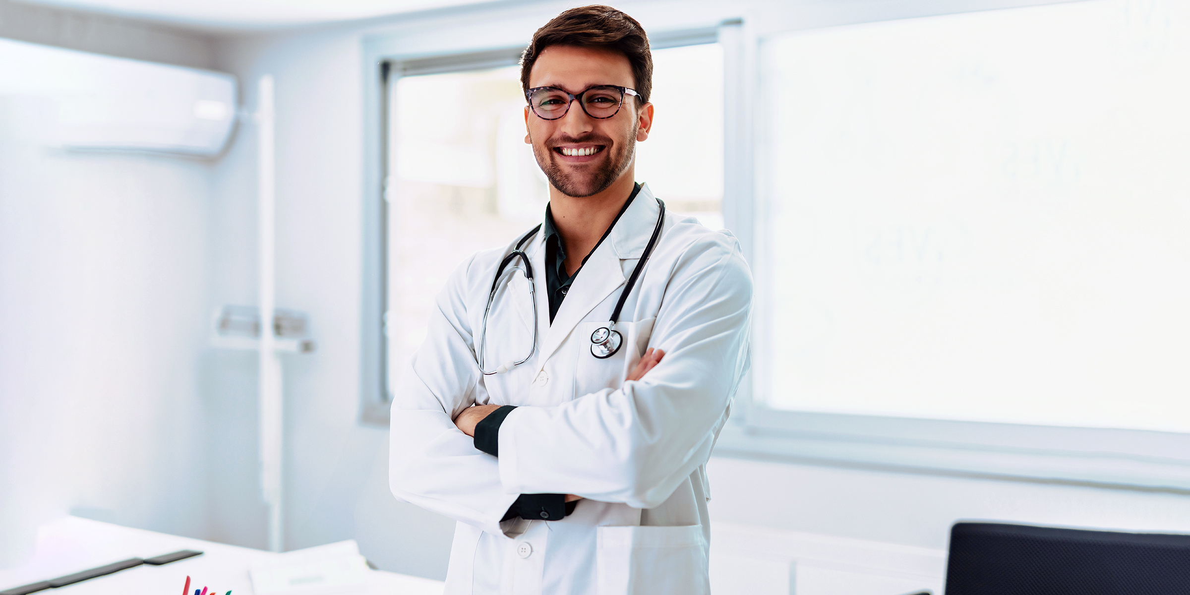 A doctor smiling widely at the camera | Source: Shutterstock