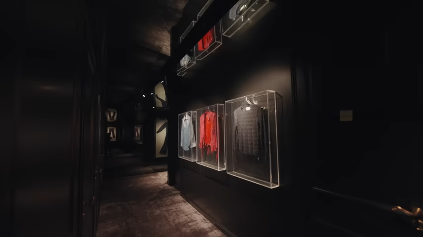 A long look down the blacked-out corridor outside Lenny's home studio, where pieces of music history are displayed like high art. | Source: YouTube/@Archdigest