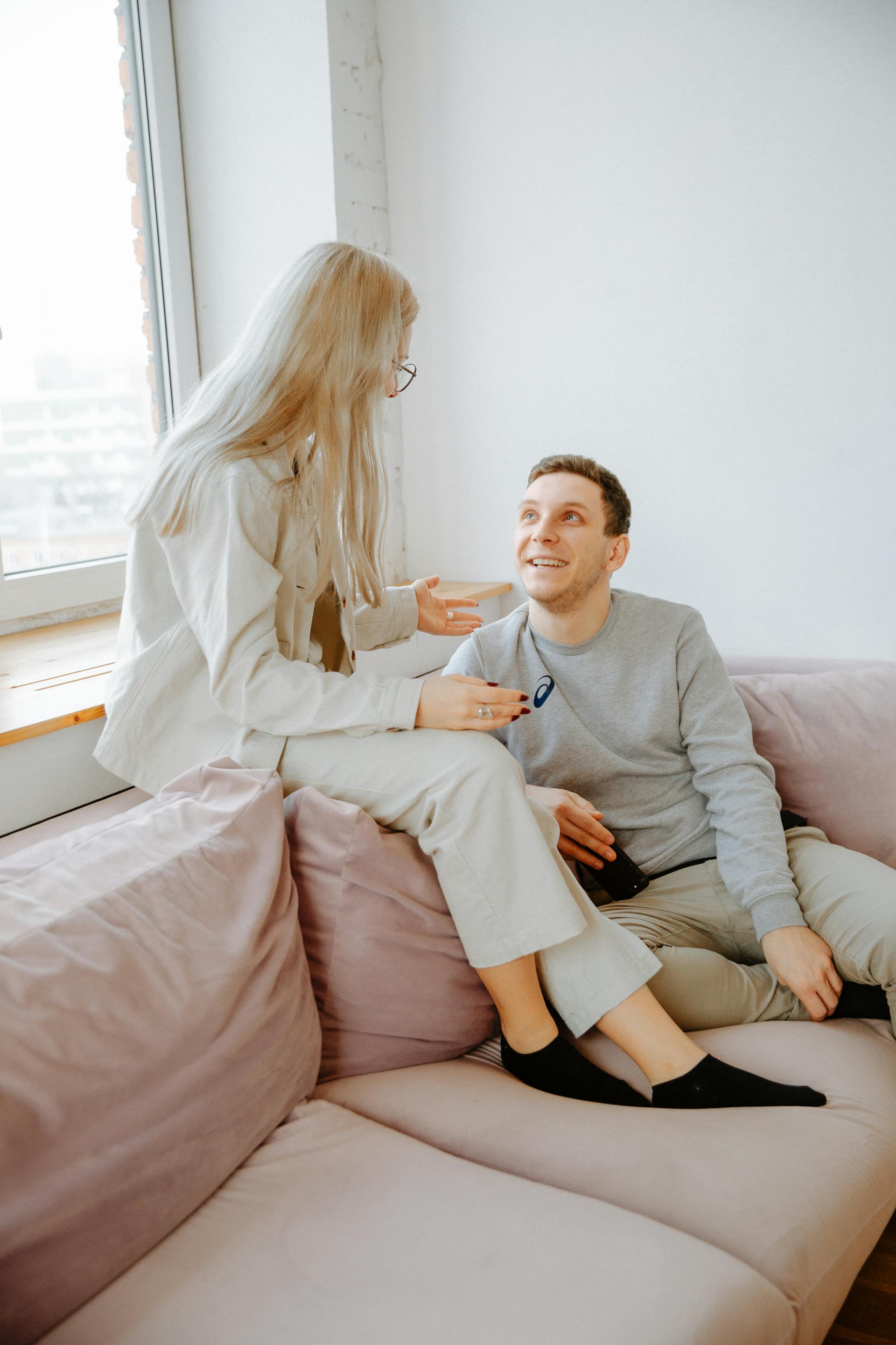 A man laughs while talking to his wife | Source: Pexels