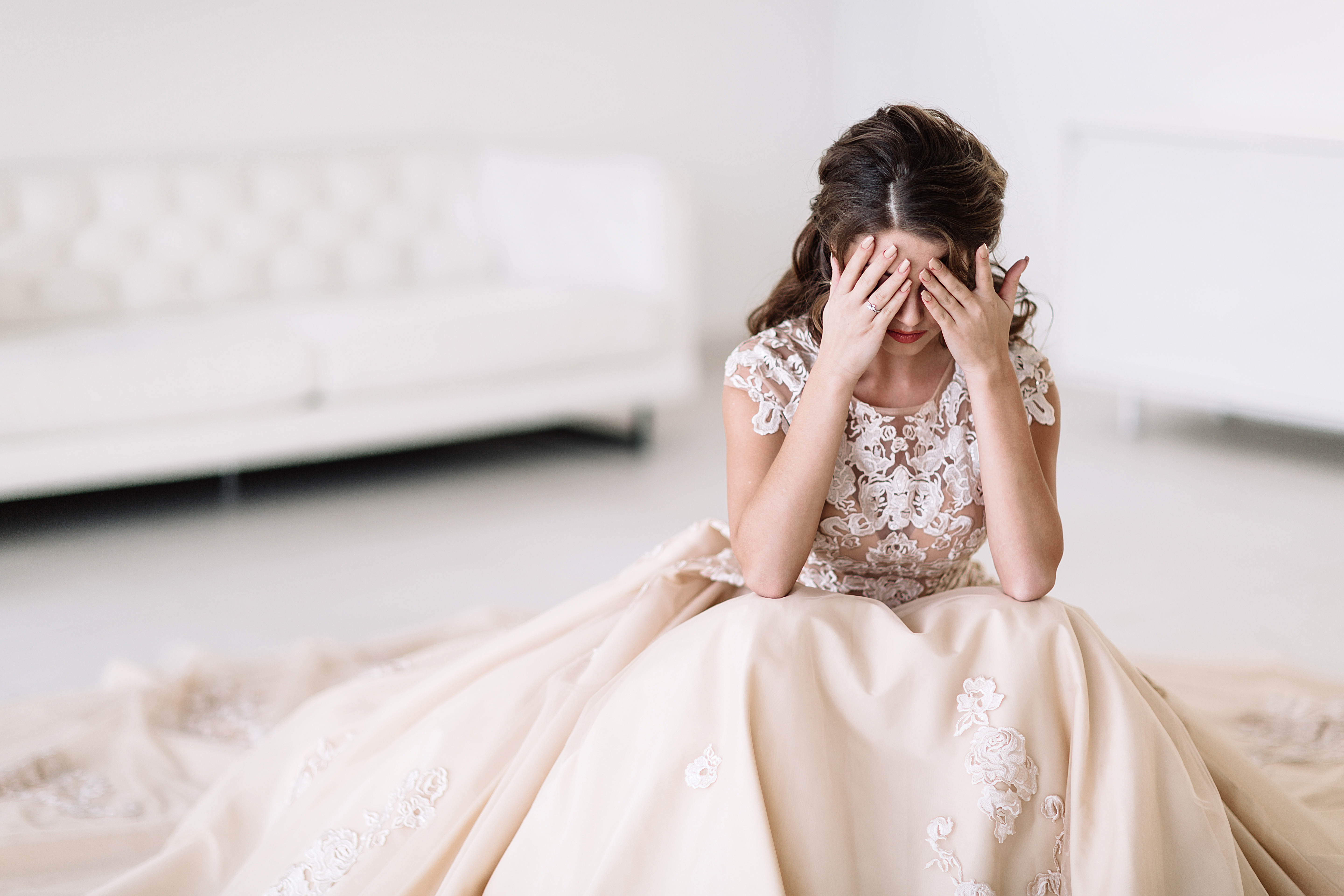A sad bride covering her eyes | Source: Shutterstock