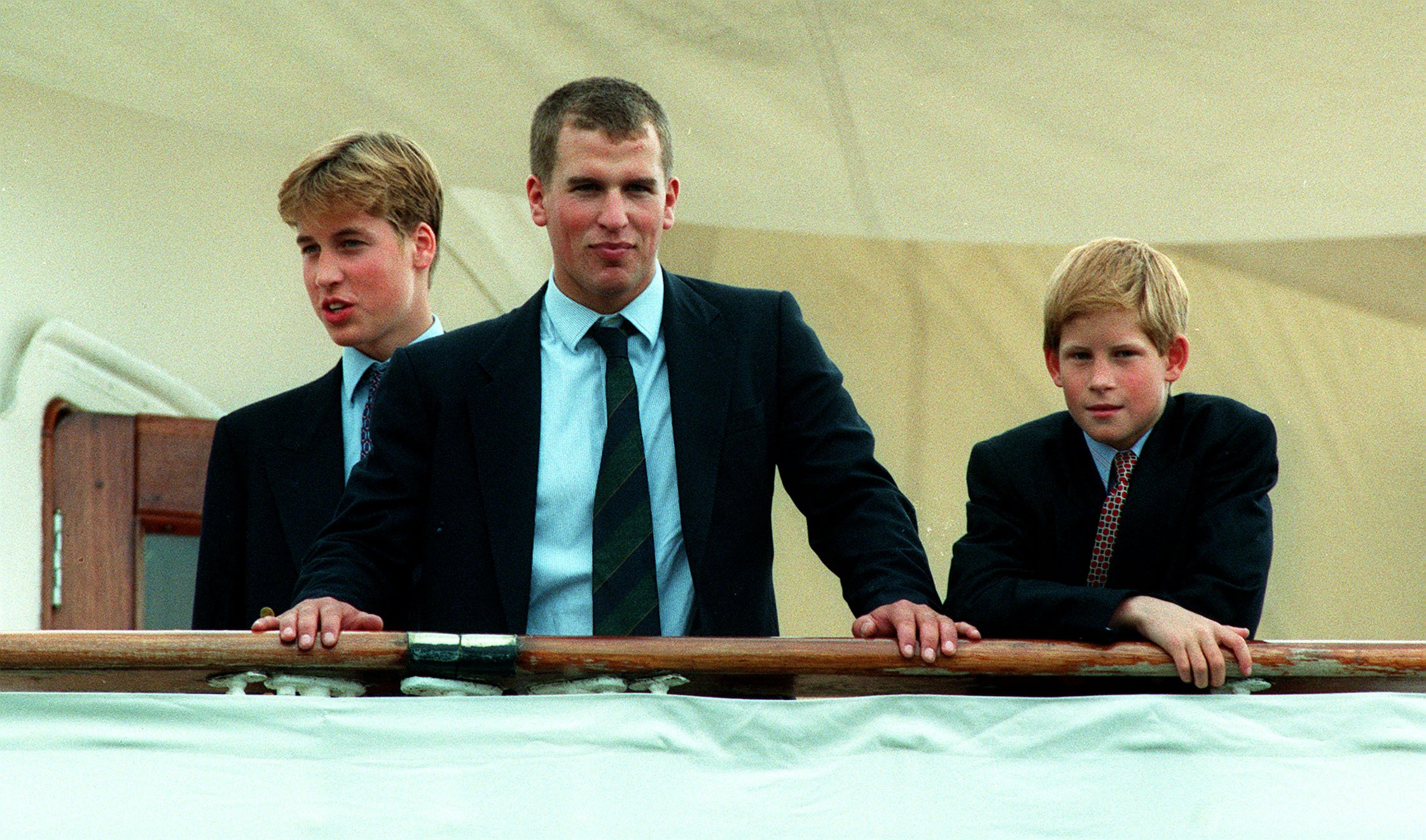 Prince William, Peter Phillips and Prince Harry join the 'Britannia' in Portsmouth for the royal family's annual trip to Balmoral via the Western Isles, possibly their last summer holiday aboard the royal yacht. August 7, 1997 | Source: Getty Images 