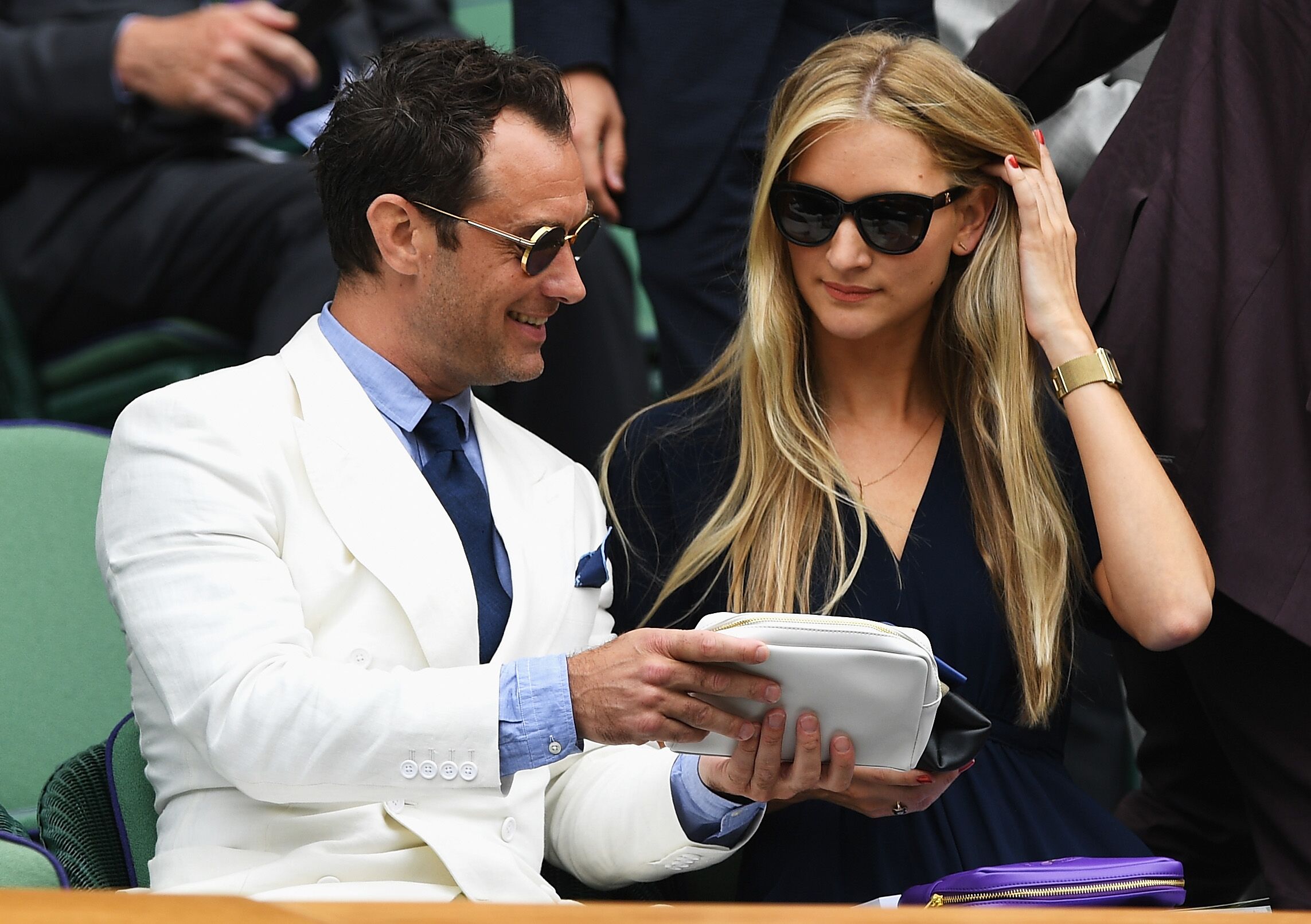 Jude Law and Phillipa Coan watch on as Roger Federer of Switzerland plays Milos Raonic of Canada in the Men's Singles Semi Final match on day eleven of the Wimbledon Lawn Tennis Championships at the All England Lawn Tennis and Croquet Club on July 8, 2016 in London, England. | Photo: Getty Images