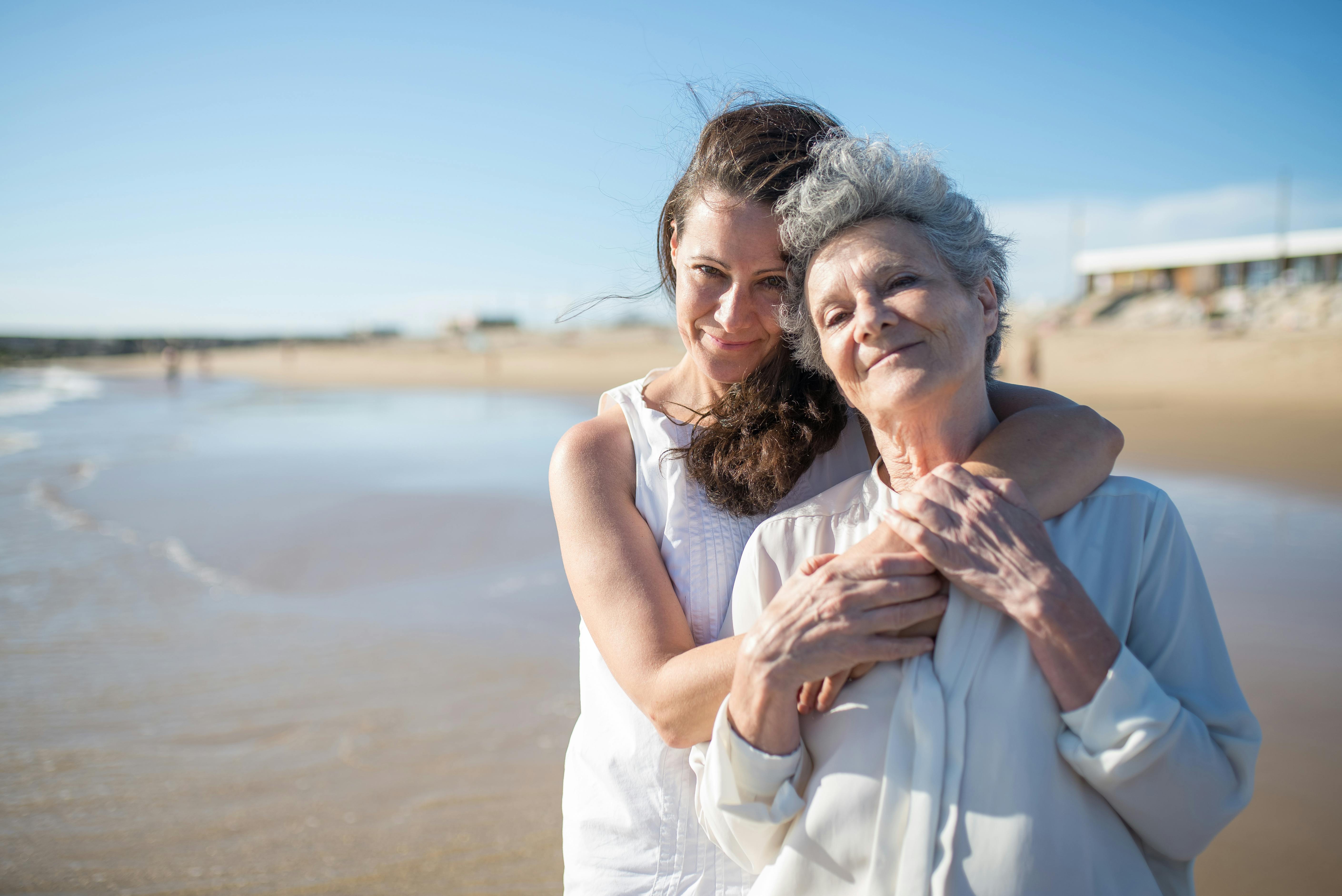 Two happy women embracing on a beachfront | Source: Pexels