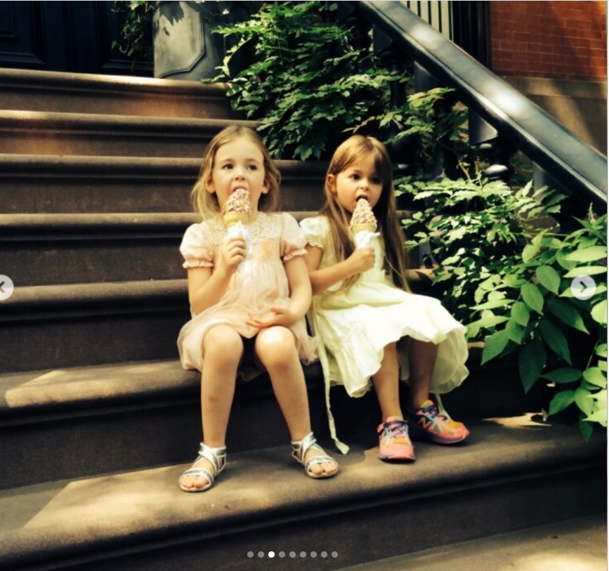 Tabitha and Marion enjoy ice cream on the steps of a brownstone in one of the nostalgic childhood photos Sarah Jessica Parker shared for their 17th birthday. | Source: Instagram/sarahjessicaparker