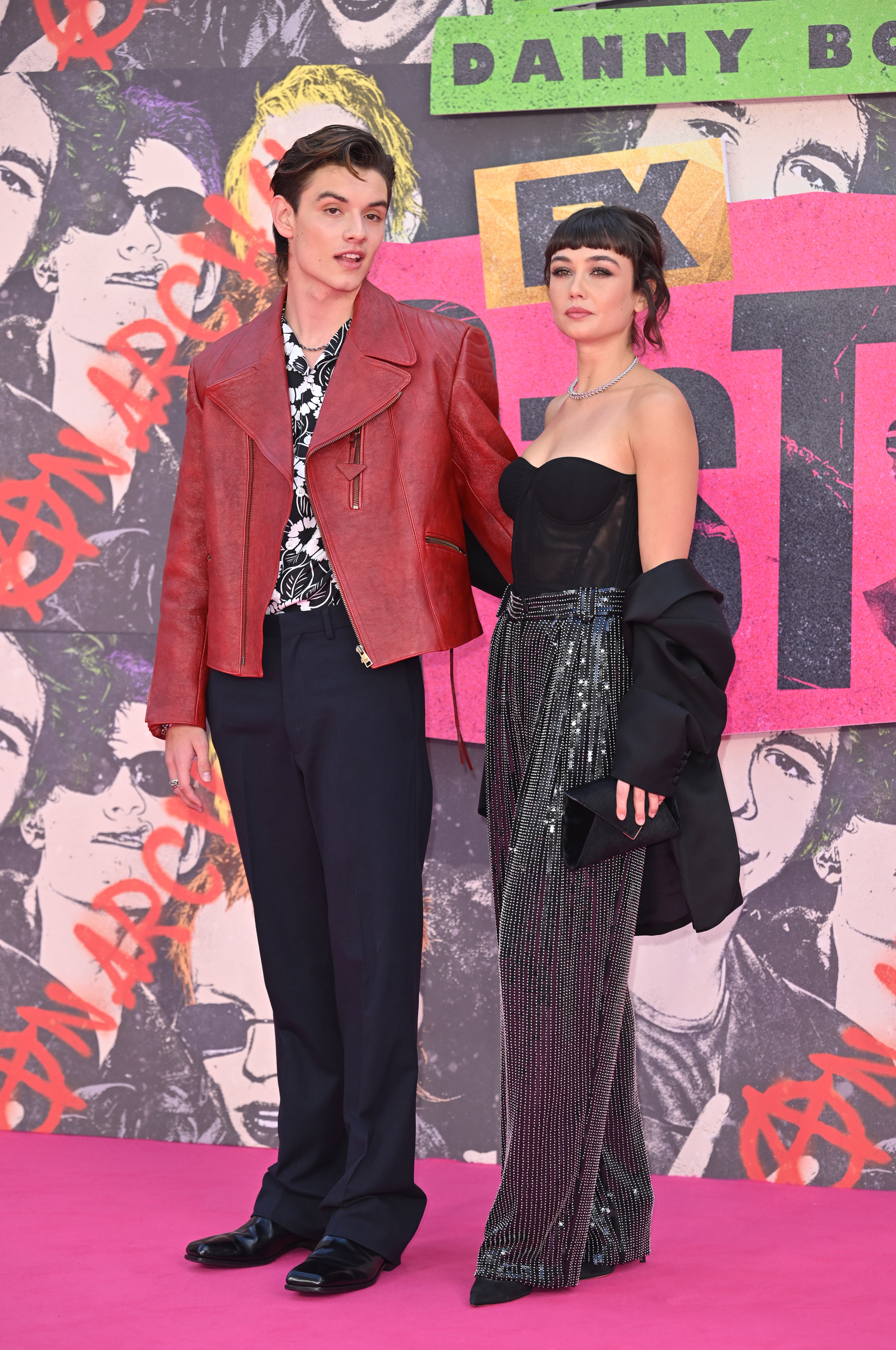 Louis Partridge and Sydney Chandler attend the premiere of the series "Pistol" at Odeon Luxe Leicester Square on May 23, 2022, in London, England.  | Source: Getty Images