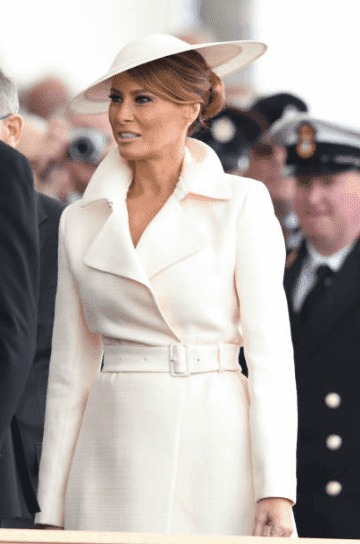 Melania Trump wears a white coat by "The Row" at the D-Day75 National Commemorative Event, on June 05, 2019, in Portsmouth, England | Source: Getty Images (Photo by Karwai Tang/WireImage)