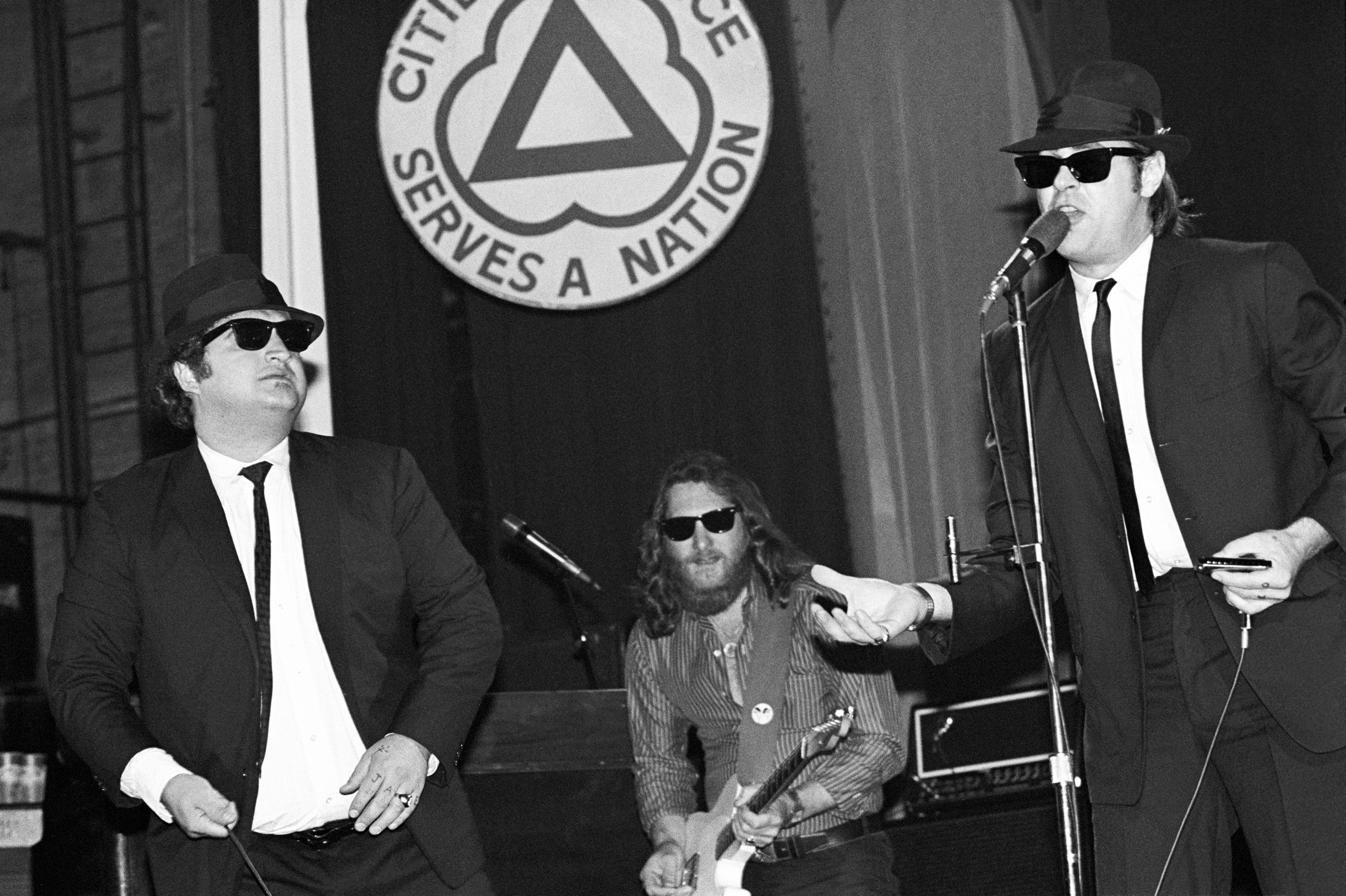 Dan Aykroyd and John Belushi with Steve Cropper in back performing with The Blues Brothers at the Palladium on 1 June 1980 in New York City. | Source: Getty Images
