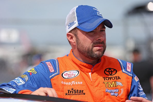 : Eric McClure, driver of the #24 Hefty Toyota, waits for qualifying for the NASCAR XFINITY Owens Corning AttiCat 300 at Chicagoland Speedway on June 20, 2015 | Photo: Getty Images