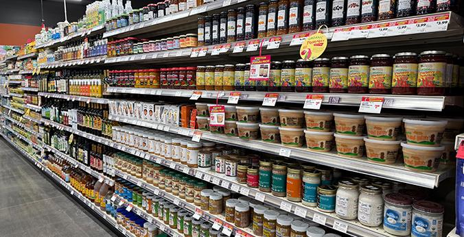 A grocery store nut butter aisle is pictured for illustration. The FDA said the recall was triggered after routine testing by the Florida Department of Agriculture and Consumer Services detected Salmonella in three jars of Bettergoods Pistachio Nut Butter at a Walmart store. No illnesses or injuries have been reported. | Source: ChatGPT