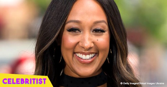 Tamera Mowry stuns in blue dress and hat while playing with her 2 kids in Portugal