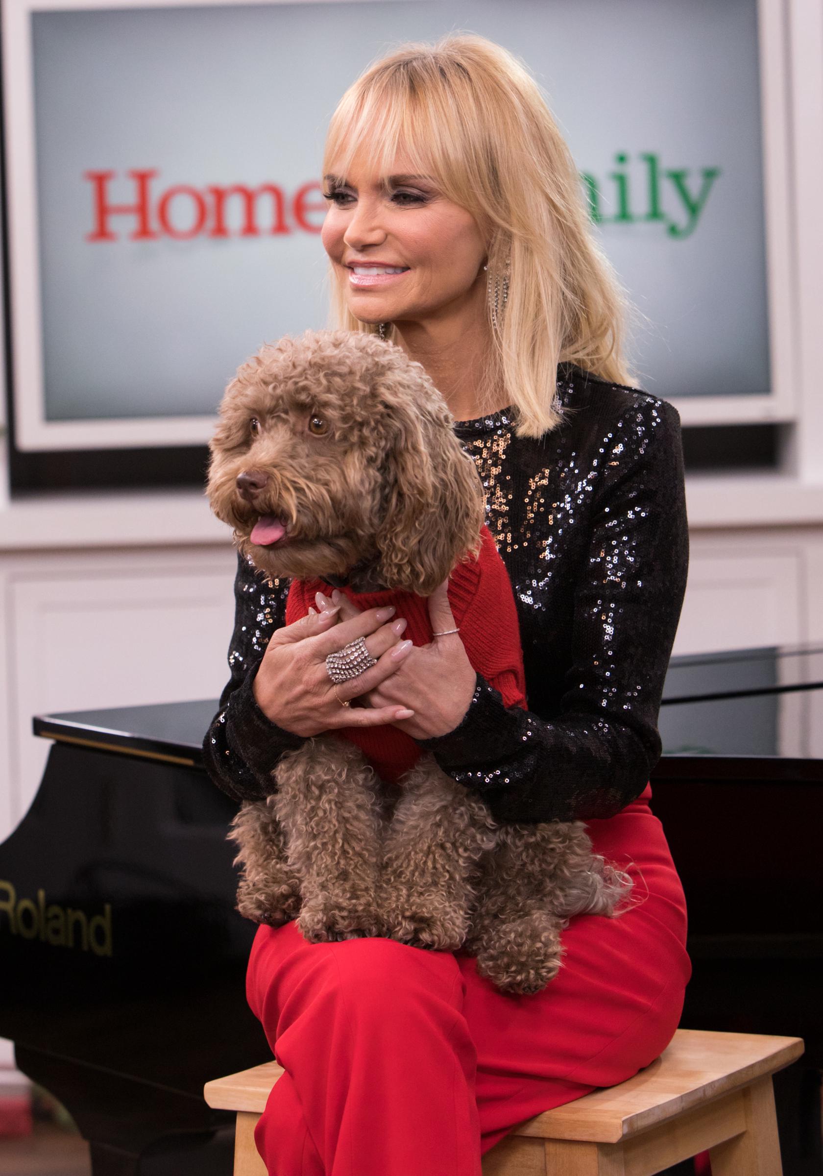Kristen Chenoweth poses with her dog Thunder on the set of Hallmark Channel's "Home & Family" at Universal Studios Hollywood on December 4, 2019 in Universal City, California | Source: Getty Images