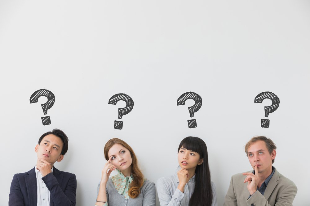 A photo that shows four people thinking | Photo: Shutterstock