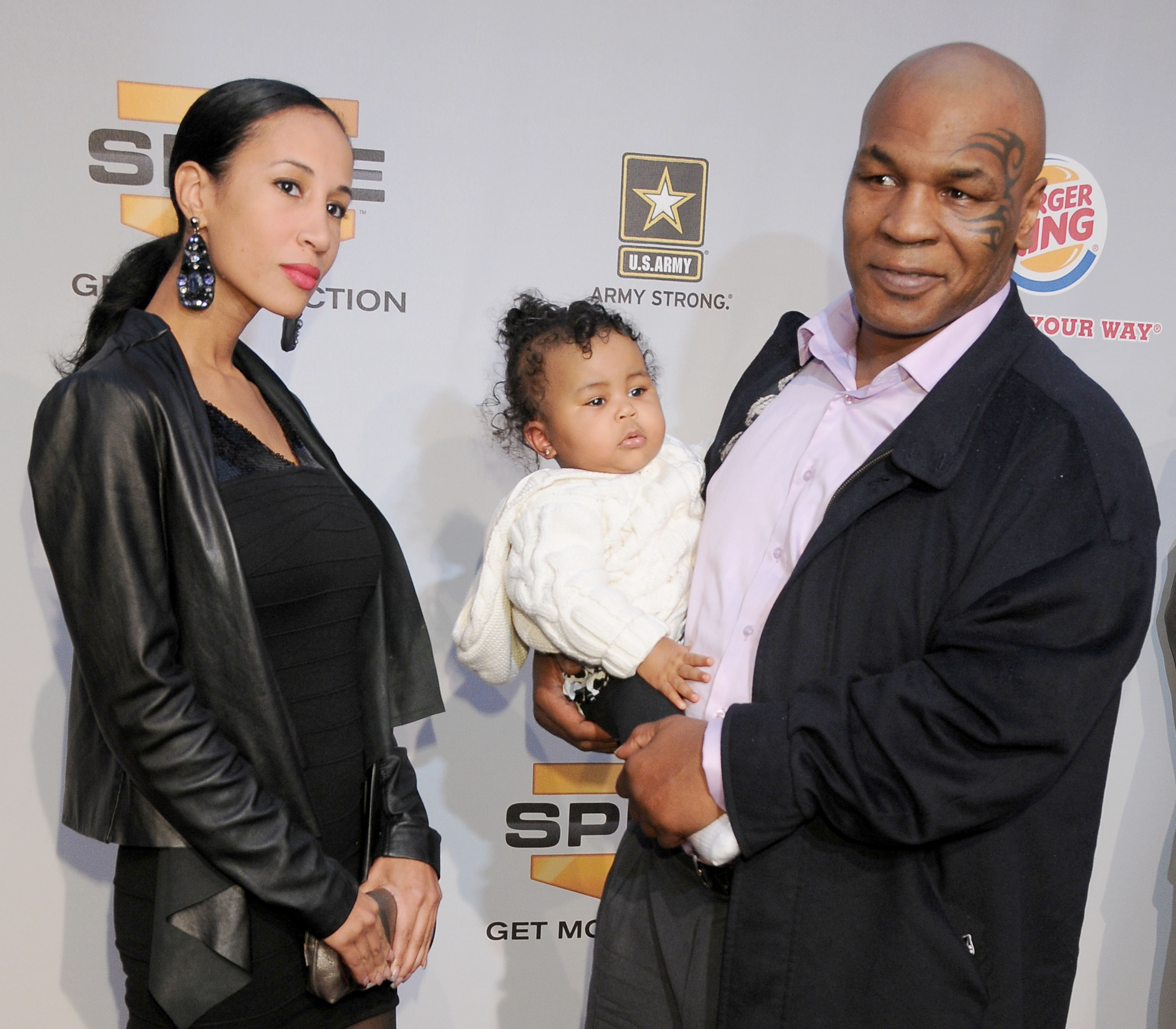 Kiki Tyson, Mike Tyson, and their daughter Milan arriving at Spike TV's Video Game Awards 2009, in Los Angeles, California, on December 12, 2009 | Source: Getty Images