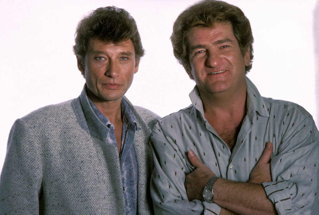 Eddy Mitchell et Johnny Hallyday en octobre 1984. | Photo : Getty Images