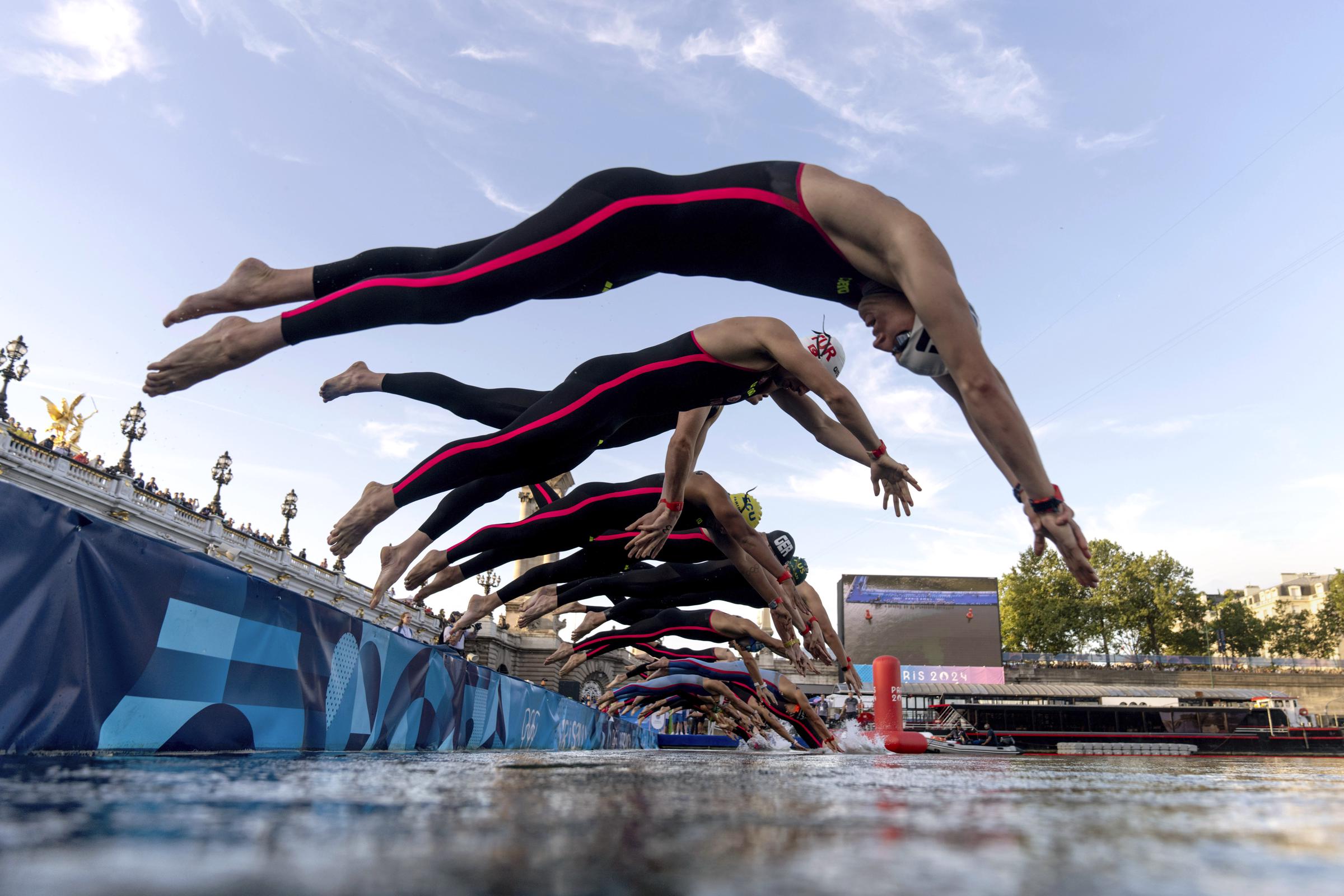 Competitors dive into the Seine River for the start of the Marathon Swimming Men's 10km event at the 2024 Paris Olympics on August 9, 2024 | Source: Getty Images