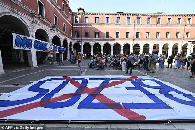 Demonstrators (pictured) have also been plotting to clog up streets and canals to throw off the wedding's events and hinder the roughly 200 guests from getting around the city
