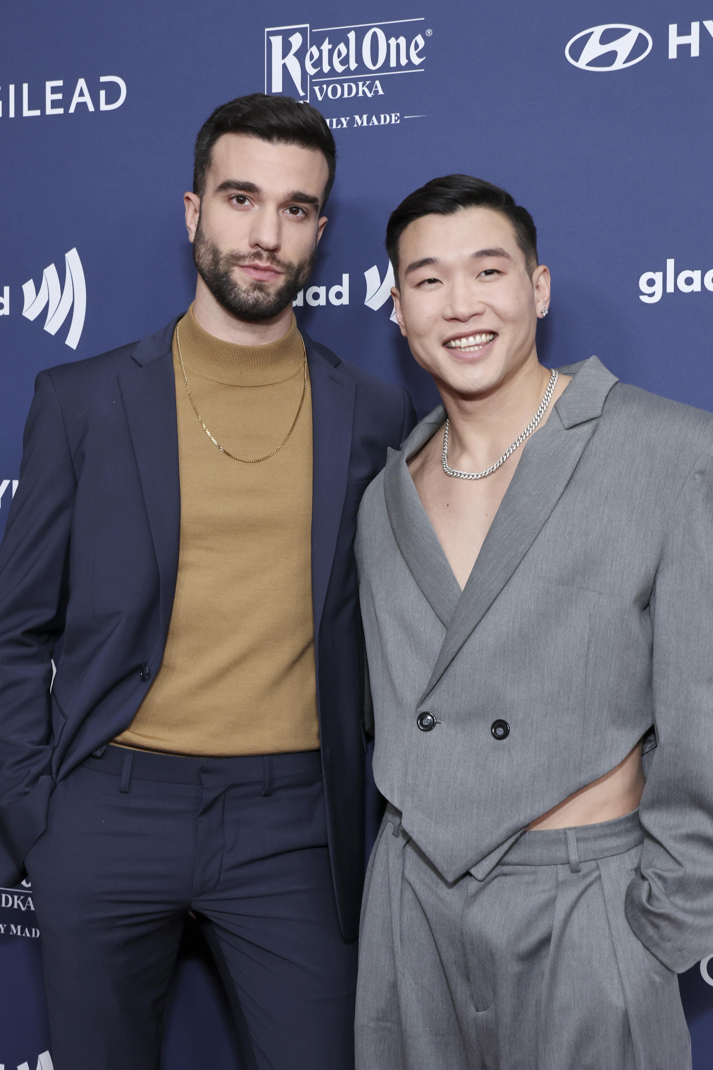 John-Michael Sudsina and Joel Kim Booster pose at the GLAAD Media Awards at The Beverly Hilton on March 30, 2023 in Beverly Hills, California |  Source: Getty Images
