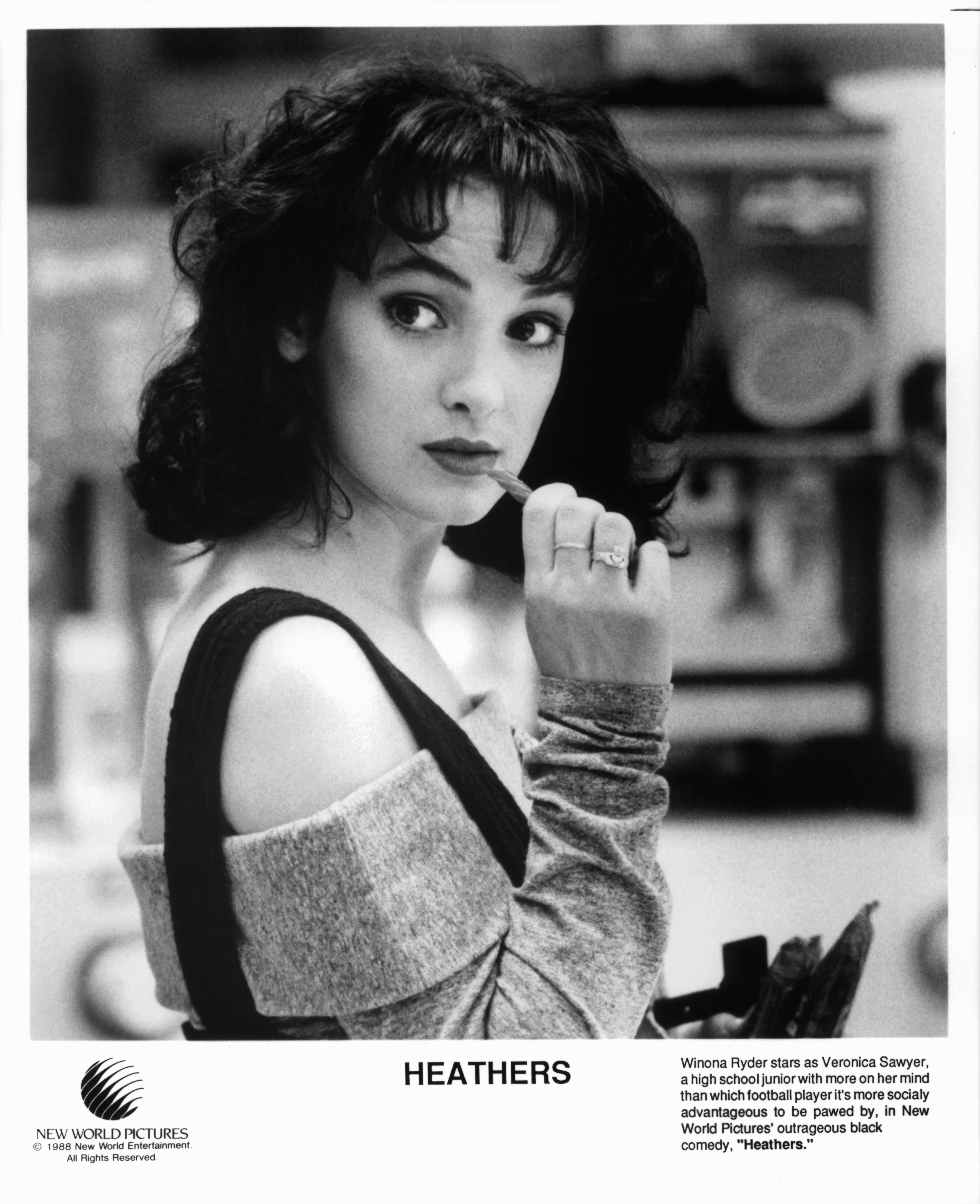 Winona Ryder is about to chew on a candy in a scene from the film "Heathers" in 1988. | Source: Getty Images