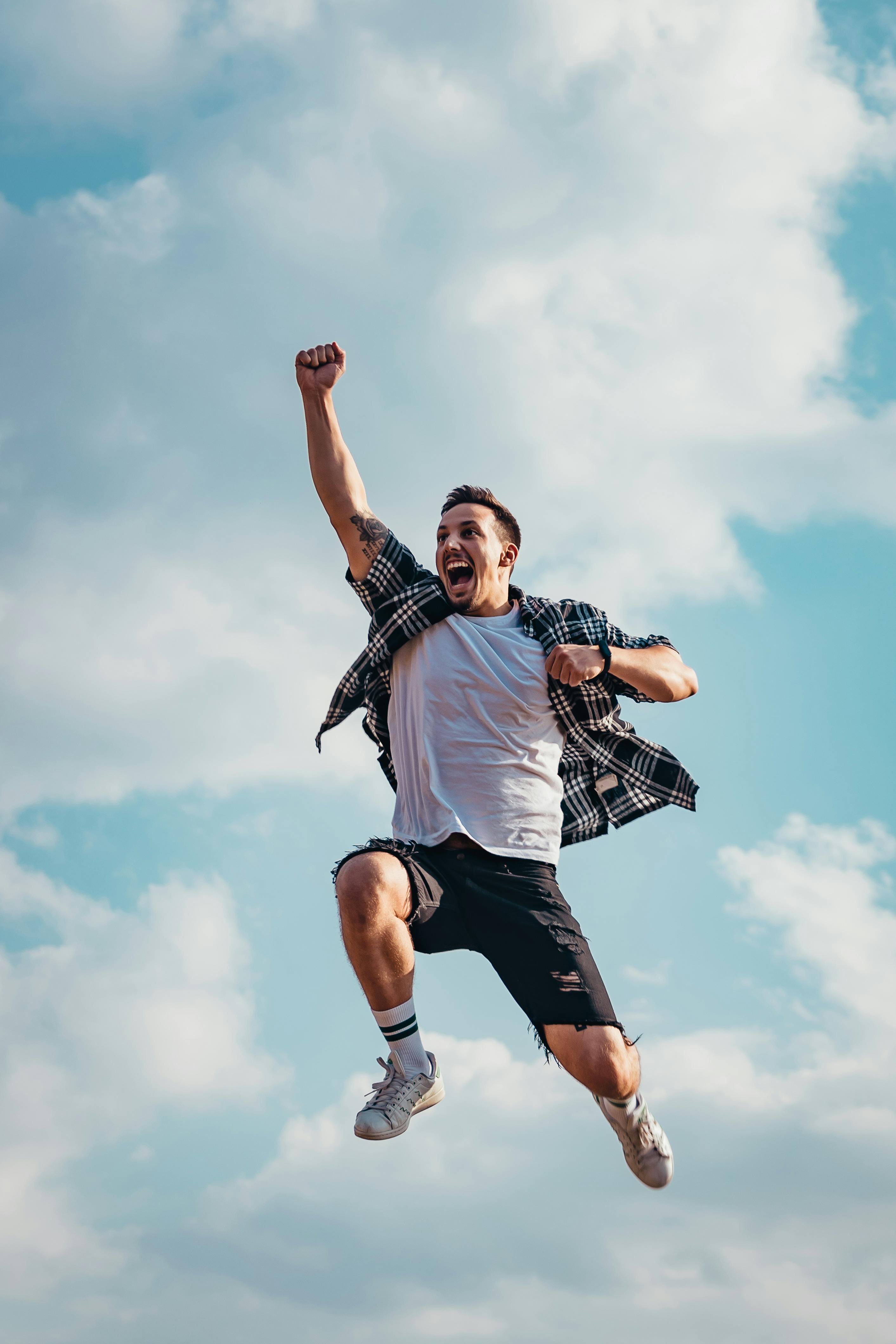 An elated man jumping for joy while celebrating | Source: Pexels