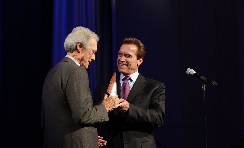 Clint Eastwood (L) accepts his award from Arnold Schwarzenegger, Governor of California during the Museum of Tolerance International Film Festival Gala. | Photo: Getty Images