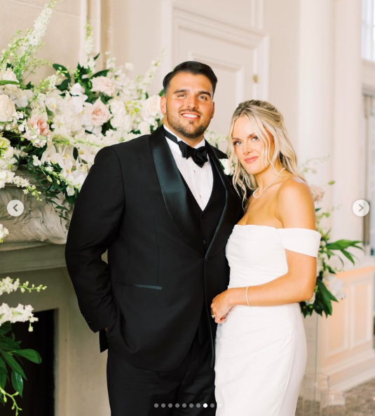 Jon Runyan Jr. and Victoria Schultz posing for a photo on their wedding day, posted on August 7, 2024 | Source: Instagram/antpagephoto, classiceventsbylauren and alenkafilms