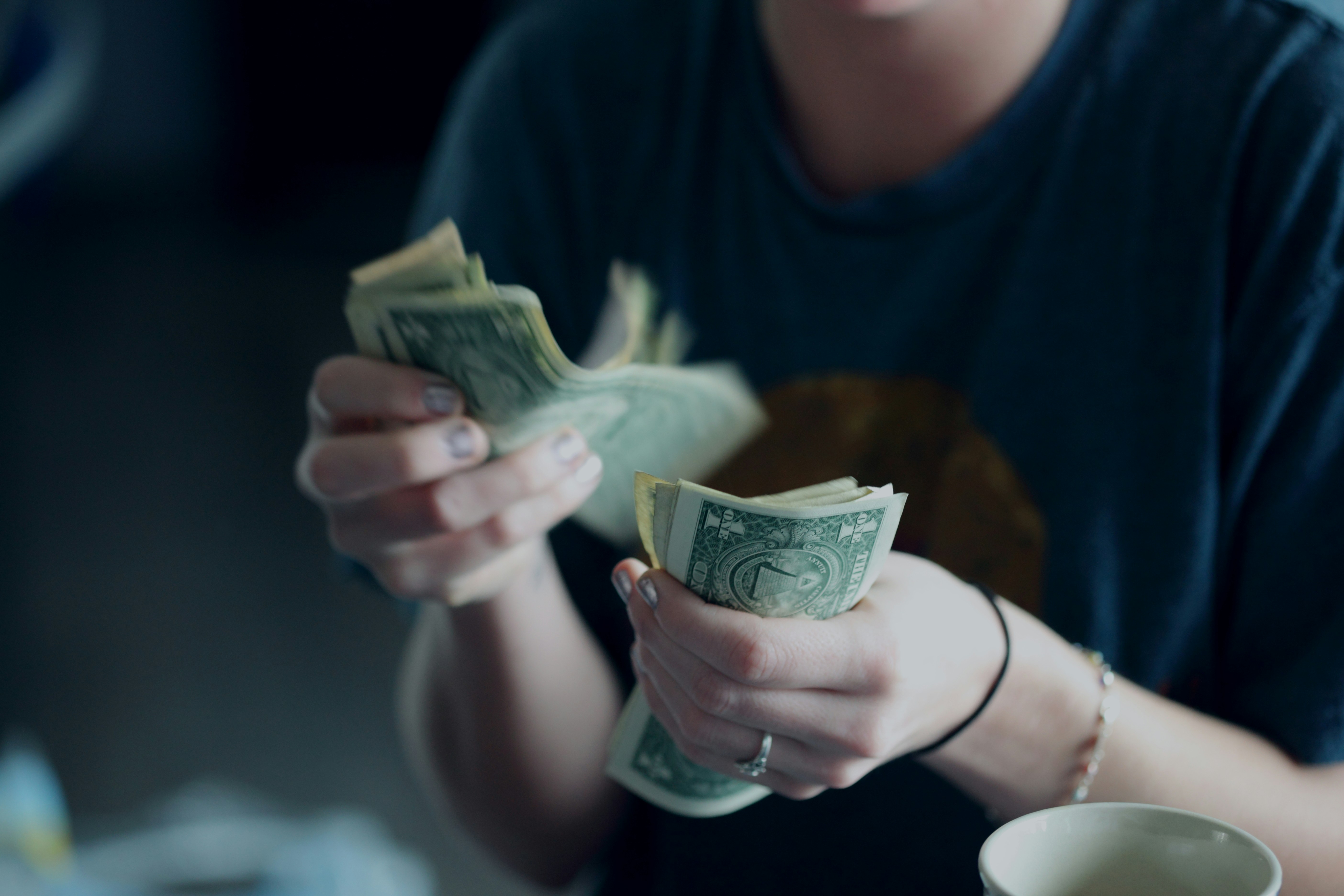 A woman holding money | Source: Pexels