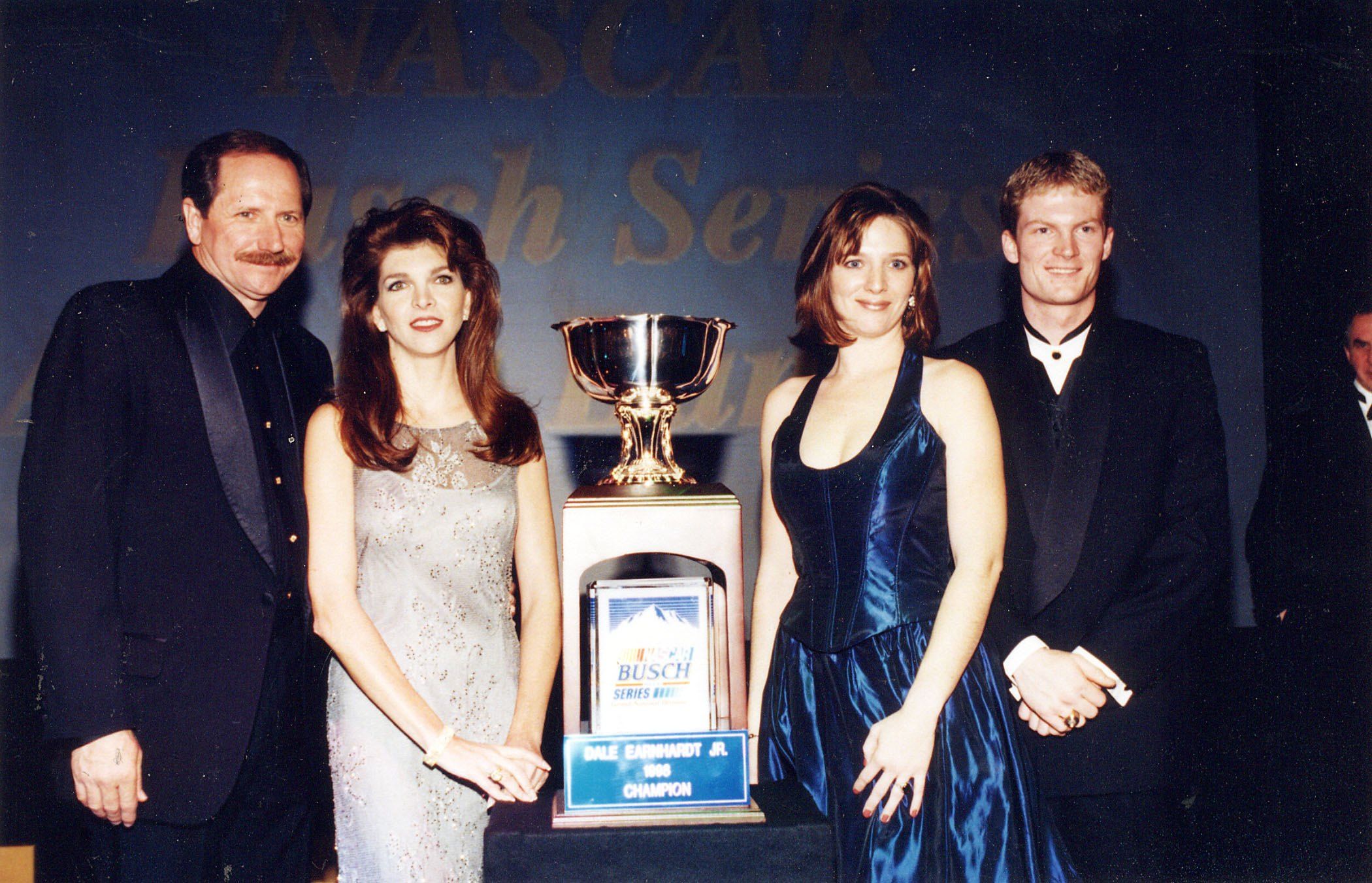 Dale Earnhardt Sr., with wife Teresa, daughter Kelley and son Dale Earnhardt Jr., who received the NASCAR Busch Series Championship Cup in 1998 in New York | Source: Getty Images